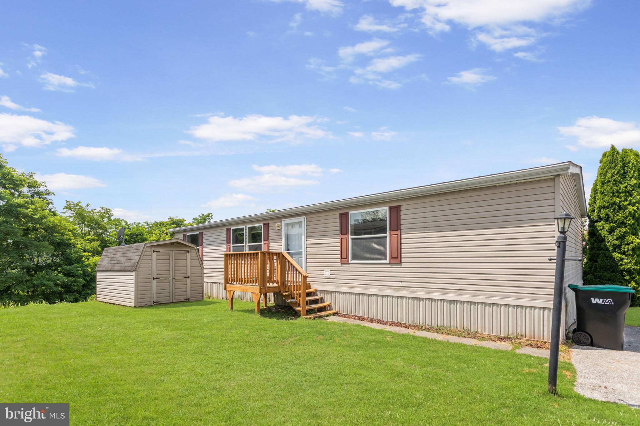 Affordable 1-floor living in this updated 3BR/2BA Champion 2006 manufactured home in Eagle View MHC, Conewago Valley school district. Inside you will find newer plank flooring throughout the entire home, neutral paint colors, and a beautiful feature wall in the living room. Primary bedroom has its own full bathroom with a step-in shower and separate soaking tub. On the other end of the home are 2 more bedrooms and a full bath. The 2nd full bath has a walk-in shower with glass doors and a skylight above (replaced when the roof was installed). Laundry room has a stacked washer & dryer. Kitchen appliances included (extra quiet dishwasher). New Roof installed in 2021, Water Heater in 2020, Bottom Kitchen Cabinets/Countertops/Appliances in 2023. Lot rent is subject to change and buyer(s) must be park approved before submitting a contract.