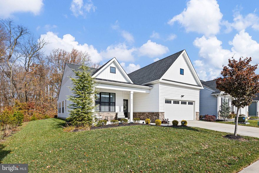 Welcome home to 511 Davis Falls Drive, a stunning 2 Bedroom, 2 Bath residence in The Cascades, Newark’s premier 55+ active adult community. Offering low-maintenance living and resort-style amenities—including a clubhouse, fitness center, and seasonal outdoor pool—this home combines comfort, style, and convenience in one perfect package.
The charming farmhouse-style exterior and welcoming front porch set the tone for the thoughtfully designed interior where everything you need is on the first floor. Step inside to find an open-concept layout with 9-foot ceilings and abundant natural light. The gourmet kitchen features upgraded 42" white cabinetry, subway tile backsplash, quartz countertops, a large island with seating, and a stainless steel appliance package with gas cooking. The kitchen flows seamlessly into the dining area and family room, complete with a cozy fireplace.
French doors open to a bright rear sunroom with shiplap accents, overlooking open space and mature trees—a peaceful retreat perfect for morning coffee or evening relaxation. The flex/living room off the foyer adds even more versatility for entertaining or quiet reading.
The expansive primary suite is a private oasis featuring a tray ceiling, two generous walk-in closets, and a spa-inspired bath with double-bowl vanity and an oversized tile shower with bench. A second bedroom and full bath provide comfortable accommodations for guests.
Additional highlights include:
Spacious 2-car garage, partially attic above garage with convenient stair access (ideal for storage, a home office, studio, or hobby room), Lennox HVAC system and tankless water heater for energy efficiency, and the beautiful window treatments are included
Enjoy The Cascades’ easy-care lifestyle with lawn maintenance and snow removal included, plus easy access to major roads, shopping, restaurants, and nearby Glasgow Park.
511 Davis Falls Drive — A beautiful blend of luxury, comfort, and convenience in Newark’s sought-after 55+ community.