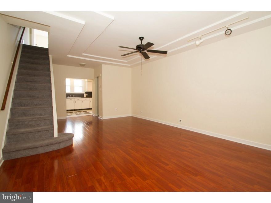 Welcome to this lovely 2 bedroom plus den, 1 bath home on a charming tree-lined block in the heart of Passyunk Square! Vestibule entrance leads in to the living/dining room area offering beautiful hardwood floors, 2 windows and recessed lighting. The large eat in kitchen boasts plenty of natural light, cabinetry and counterspace- perfect for those who love to cook! Nice rear yard for grilling and relaxing. Upstairs you'll find a front bedroom with two windows, high ceilings, closets and a door to a den (currently used as a super large walk-in closet). This level also offers a large bathroom and a spacious rear bedroom with window and closet. The finished basement doubles as a second living space/family room and offers two closets, laundry area and mechanicals. Close to everything ? this is the neighborhood you want to be in!! Look past the clutter and see the potential. Don't miss!