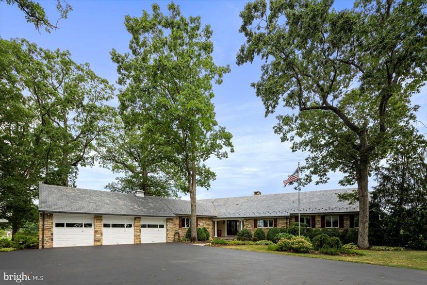 Magnificent country estate. This expansive, solid stone ranch home consists of 5000 square feet of main floor living space which has been built, maintained and updated with the utmost quality and care. The incredibly serene setting will instantly give you a sense of peace.  The 5.84 pristine acres is comprised of a spectacular water feature with koi pond, multiple patios, in-ground pool, meticulous landscaping and endless views. Quality craftsmanship is reflected throughout the home.  Starting at the front door with a flagstone patio, once you step into a large entry foyer with hardwood floors the views begin from there.  The living room has a large, stone, floor to ceiling wood burning fireplace, hardwood floors, beamed ceiling and is connected to the dining room, separated by an open staircase to the lower level.  The large kitchen features a huge island, Subzero refrigerator and separate Subzero freezer, 2 Bosch ovens, Bosch dishwasher and has been recently updated with lovely quartz countertops, tile backsplash, lighting and more.  Located just off the kitchen is a breakfast room which is surrounded by windows highlighting the exceptional views. The large sunroom with exposed stone walls connects to the GREAT ROOM, which is spectacular!  Use your imagination for the endless possibilities within this space… this 2005 addition is approximately 1500 square feet, surrounded by windows it features a floor to ceiling stone fireplace, soaring ceilings with steel beams encased in wood, built in shelving and window seat, radiant floor heating. On a separate wing of the home you will find the primary suite and updated primary bath, 3 additional bedrooms and full bath.  All the bedrooms have gorgeous hardwood floors, custom trim work, crown molding and sweeping views from every window.  The main floor also has a huge laundry/mudroom and a powder room. The finished lower level adds even more recreation space, a family room with beamed ceiling and stone fireplace, a huge game room plus a bonus room, half bath, loads of storage and outside entrance. Just off the back of the house is a breathtaking water feature with koi pond, several patio areas for relaxation, dining and entertaining. The outdoor kitchen has a built in 50” grill, warming drawer, refrigerator and huge granite countertop and bar seating. Just a few steps away is the beautiful in-ground pool with new tile and stone coping (2020).  The barn/outbuilding has many possibilities and the playhouse currently serves as a shed. A very special feature about this idyllic setting is that it is perfectly positioned for watching the sun rise and also the beautiful sunsets! This home embodies warmth and character… graceful Bucks County estate living and is an entertainer’s dream home! New septic system installed in 2020. Generator, 3 car attached garage. Located in picturesque Bedminster Township the property is 78 miles to NYC and 41 miles to Philadelphia.