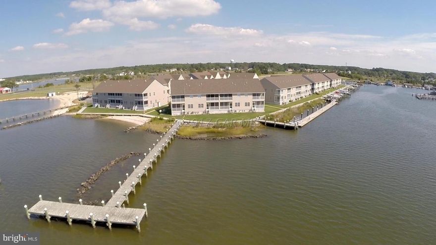Finishing touches being completed! Beautiful Townhouse style condo in Waters Edge. Deep water boat slip, community pool and pier. Come get a piece of the good life! 3.5% financing and 5% down for qualified buyers (for a limited time). Community Video: search Waters Edge, Crisfield on YouTube!