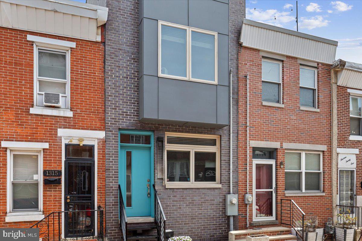 Stop looking, you've found the one! Welcome home to 1317 S Mole St. Fully rehabbed in 2019 and this place has maintained its shine. Once you open the freshly painted front door, you are greeted with gorgeous hardwood floors and ample living space. Move through the living room and you'll see there is plenty of space for a dining table for dinner parties and hosting friends. The kitchen is lined with shaker cabinets and outfitted with stainless steel appliances. A large sliding glass door lets in the most amount of light as possible to this space. Open concept living at its finest! Back through the first floor and up the floating staircase will lead you to the first of two bedroom suites. The third floor primary bedroom is set up with ample space, full bath, and tons of closet space. Take a walk through the bedroom and another set of sliding glass doors to the spiral staircase leading you to your very own private roof deck with 360 views! The basement is also fully-finished with great ceiling height. Perfect to set up your own home office! There is also laundry and a full bathroom on this level. Don't forget, this beauty still has around 4 years left on the tax abatement! Come see it for yourself today!