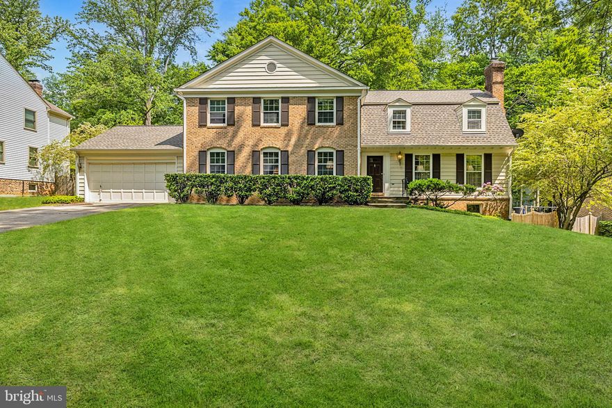 Welcome to 8009 Hackamore Drive, a charming brick colonial located in the highly sought-after neighborhood of River Falls in Potomac, Maryland. This four bedroom, three and a half bathroom home with a large main level study is a great floorplan awaiting your updates and design. Enter the main foyer where an abundance of natural light highlights hardwood flooring throughout the main level. A spacious family room with enclosed wet bar, brick wood-burning fireplace and built-in bookcase are a few of the charming details seen throughout this room. The kitchen features an eat-in area surrounded by windows, and conveniently accesses the back patio through the glass door. Completing the main level is a formal dining room with custom trim work and a living room with a wood-burning fireplace. The attached two-car garage opens into a mudroom, an ideal location for the washer/dryer, and is complete with a powder room. Upstairs, a private living area leads into the primary bedroom which features a spacious walk-in closet and en-suite bathroom with dual vanities and a shower/tub. Two additional upper level bedrooms share a Jack and Jill bathroom, while the third bedroom sits adjacent to the convenient hall bathroom. Lastly, a full unfinished basement is the perfect space to create a recreation room, fitness area or lounge area. The private, tree- lined backyard is perfect for entertaining and dining outdoors. The River Falls neighborhood is a unique community featuring a neighborhood swimming pool, tennis courts, playgrounds and fields. With easy access to Clara Barton Parkway, I-495, and trails on the Potomac River, the location is truly unbeatable. 8009 Hackamore Drive is ready for your design touch and would be a wonderful place to call home!