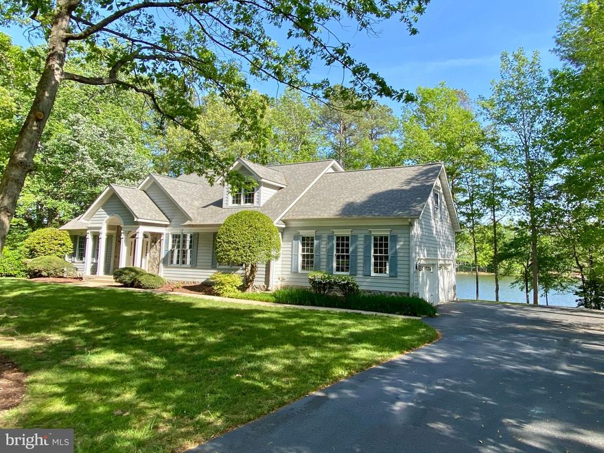 Located in the prestigious Fawn Lake Community, this Beautiful Waterfront Cape boasts 157 feet of shoreline with breathtaking lake views and offers the perfect setting to create the ultimate waterfront lifestyle you have been dreaming of! First time offered, this lakeside retreat features a semi-open floor plan that can be easily enhanced with cosmetic updates. A Family Room that sits at the center of the home features a gas fireplace and glass doors offering access to the deck and spectacular lake views.  A beautiful Study with built-in bookcases offers an ideal space for working while enjoying the incredible waterfront scenery. The spacious Kitchen flows into a charming Breakfast area with large windows overlooking the lake. An adjoining Dining Room is perfect for formal gatherings.  The Main level Owner's Suite with a private Bath and a large walk-in closet features French Doors that provide private access to the expansive deck. Upstairs, a huge Family Room with large windows inviting plenty of natural light and views of the calming waters is anchored by three spacious Bedrooms with walk-in closets and a Full Bath.  
The finished  walk-out Basement, with a Rec Room, two Bedrooms, Full Bath and several unfinished areas, offers endless potential for living options and future expansion. Large windows and glass doors offer incredible lake views and access to the idyllic private backyard oasis. 
This special property provides endless possibilities to reimagine and create your Dream Lake House with incredible entertaining and outdoor living options.  
With 157 feet of waterfront frontage, the possibilities are endless. Imagine kayaking, fishing, swimming, or boating right from your private dock! You can even watch the Annual Fawn Lake Fourth of July Fireworks from your own backyard! Embrace the serenity of this waterfront sanctuary and this opportunity to savor the ultimate Fawn Lake lifestyle!

Come experience what the Fawn Lake lifestyle is all about where every day is a vacation! Located within walking distance to the Country Club Restaurants, tennis, golf, beach, fitness center, marina and all the wonderful amenities Fawn Lake has to offer! *** The exclusive gated Fawn Lake Community offers amazing amenities such as a boating recreational lake, soccer & ball fields, basketball & pickle ball courts, dog park, volleyball courts, walking trails, Club House, marina, fitness center, Lakeside Restaurants, Country Club, playgrounds, and so much more! Located on the countryside near protected park lands and only a few miles to the farm market, wineries and award winning brewery!