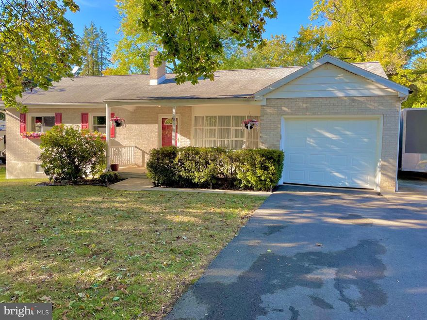 Move right in to this freshly updated three bedroom, two bath all brick ranch home on .55 acre flat lot.  Hardwood floors and ceramic tile throughout.  Multi source heat(oil, propane, heat pump/central AC), low-e vinyl windows, newer roof (2012).  Enter into the living room featuring a warm pellet stove and built in shelving. Kitchen with appliances remaining, new gas range.   Solid surface counter tops with soap stone tile backsplash. Also spend your spare family time together in the finished pine wood lower level family/game room. Relax on the rear covered patio overlooking the large yard.  One car garage with attic storage (full house), detached two car garage/workshop with water and electric and a greenhouse with electric and water. Property includes HD  Commercial 4K video surveillance system .