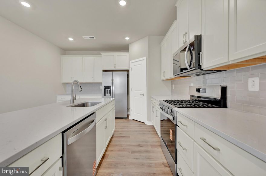 *June Move-In | 2 Bedrooms | 2 Baths | 2-Car Garage.*  Welcome home to easy, elegant living in this thoughtfully designed single-story residence, perfectly suited for an active adult lifestyle. From the moment you enter, you’ll appreciate the warm, inviting feel and smart layout that offers both comfort and flexibility. A private guest bedroom and full bath just off the foyer create the ideal space for visiting family or a quiet home office. The heart of the home opens beautifully into a light-filled kitchen, dining area, and Great Room, all flowing seamlessly to a covered patio—perfect for relaxing mornings or effortless entertaining. Tucked away at the back of the home, the owner’s suite offers a peaceful retreat, complete with a tray ceiling, spacious walk-in closet, and a well-appointed en-suite bath. Thoughtful finishes throughout include a cozy fireplace and low-maintenance Toasted Taupe wide plank flooring, adding warmth and style to the main living spaces. The kitchen shines with classic white cabinetry, Carrara Breve countertops, and a Fawn Gloss tile backsplash. For added ease, the home also includes a washer, dryer, and refrigerator. As the only attached twin home design in the community offering a 2-car garage, this is a rare opportunity to enjoy low-maintenance living without compromise.

About the community: Noble's Pond is an established 𝐚𝐜𝐭𝐢𝐯𝐞 𝐚𝐝𝐮𝐥𝐭 community with A+ amenities and award-winning lifestyle director. Everywhere you look at Noble’s Pond, you’ll find award-winning amenities designed to help you create a 55+ experience that’s everything you imagined and more.  The amenities are true "must-sees" in person, but here is a short list: Swimming Pool with an Olympic Lane, Fitness Room, Outdoor Kitchen and Covered Veranda, Community Gardens, Putting Green, Four Bocce Courts, additional Gardens, The Gathering Point, featuring ballroom seating for up to 320 people, New Fitness and Wellness Center,  Conservatory with a beautiful Stone Fireplace and two flat screen TVs, creative Center, Computer Center, Library, Game Room with two billiards tables, poker table, dart board...and so much more!

*Pictures of are model home and for representational purposes only. Please see New Home Consultant for details. Taxes to be assessed after settlement. If using a Realtor: the agent's client must acknowledge on their first interaction with Lennar that they are being represented by a Realtor, and the Realtor must accompany their client on their first visit. If coming for an open house, please visit us at 233 Cosmos Lane for access.*