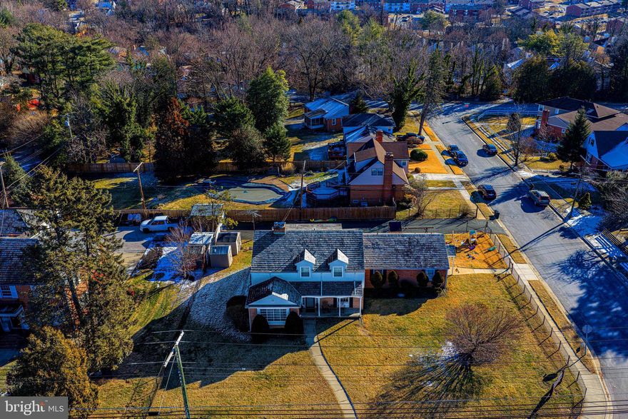 Rare and unique opportunity to live where you work!!! This charming, mostly brick southern-style cape cod offers incredible versatility and income potential- including an in-law suite ideal for multi-generational living, potential office space, daycare, assisted living, or rental apartment income (buyer to verify zoning and permitted uses with Baltimore County). The current owner has successfully operated a daycare here for approximately 20 years!

The main residence is filled with timeless charm yet thoughtfully updated with modern finishes and is in impeccable condition! The stunning, updated kitchen showcases honed granite countertops, a center island, stainless steel appliances, a gas range, and a breakfast bar. Open to the kitchen, the family room has exposed beams and a wood-burning fireplace, creating a warm and welcoming gathering space. A sunroom-style flex area off the family room is perfect as a breakfast nook or casual sitting area.

Additional main-level spaces include a separate dining room that could easily serve as a home office, playroom, or or flex space, and a classic living room with custom built-ins and a second wood-burning fireplace with deft blue tile surround. The renovated powder room has  wainscoting and eye-catching gray, black, and white floral tile flooring. Additional features include hardwood floors, stone floors,  slate roof, updated lighting. 

Upstairs, the spacious primary suite offers a large walk-in closet and a beautifully renovated ensuite bath featuring dual vanity, a soaking tub, a separate shower, shiplap, and charming modern farmhouse-inspired finishes. Additional bedrooms are generously sized, complemented by an updated full hall bath.  The upper-level laundry adds everyday convenience.

The finished lower level expands the living space with a recreation room, a separate den/office, and a large storage area complete with a second washer and dryer and half bath.

The in-law suite is thoughtfully designed with both interior access to the main home, a private exterior entrance, and is equipped with a separate electric meter. The suite includes a large family room, multiple other rooms ideal for offices or bedrooms, storage, a bath, and a full kitchen. The interior access to the in-law area is via a flex space perfect for a private office, could be a large pantry, craft room, etc. 

Outdoor living features a covered front porch—perfect for relaxing and watching the world go by—and a covered rear porch ideal for private dinners or morning coffee. The long private driveway accommodates up to 10 vehicles, complemented by aluminum fencing with a gated entrance and ample street parking.  Two play sets and the two storage sheds convey. All furniture is also negotiable. 

A truly rare offering with charm, flexibility, and opportunity—this is a must-see property with possibilities you don’t often!