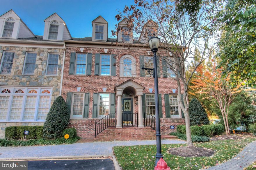 Offering easy luxury living in McLean's premiere gated community, this Evans Farm end-unit townhouse showcases quality craftsmanship on a grand scale. This Albemarle model, one of Evans Farm's largest townhouse floorplans, features an elevator, 2-car garage accessed via the main level, chef's kitchen with Subzero & Viking appliances, California Closets, grand owner's suite, brick courtyard, & more