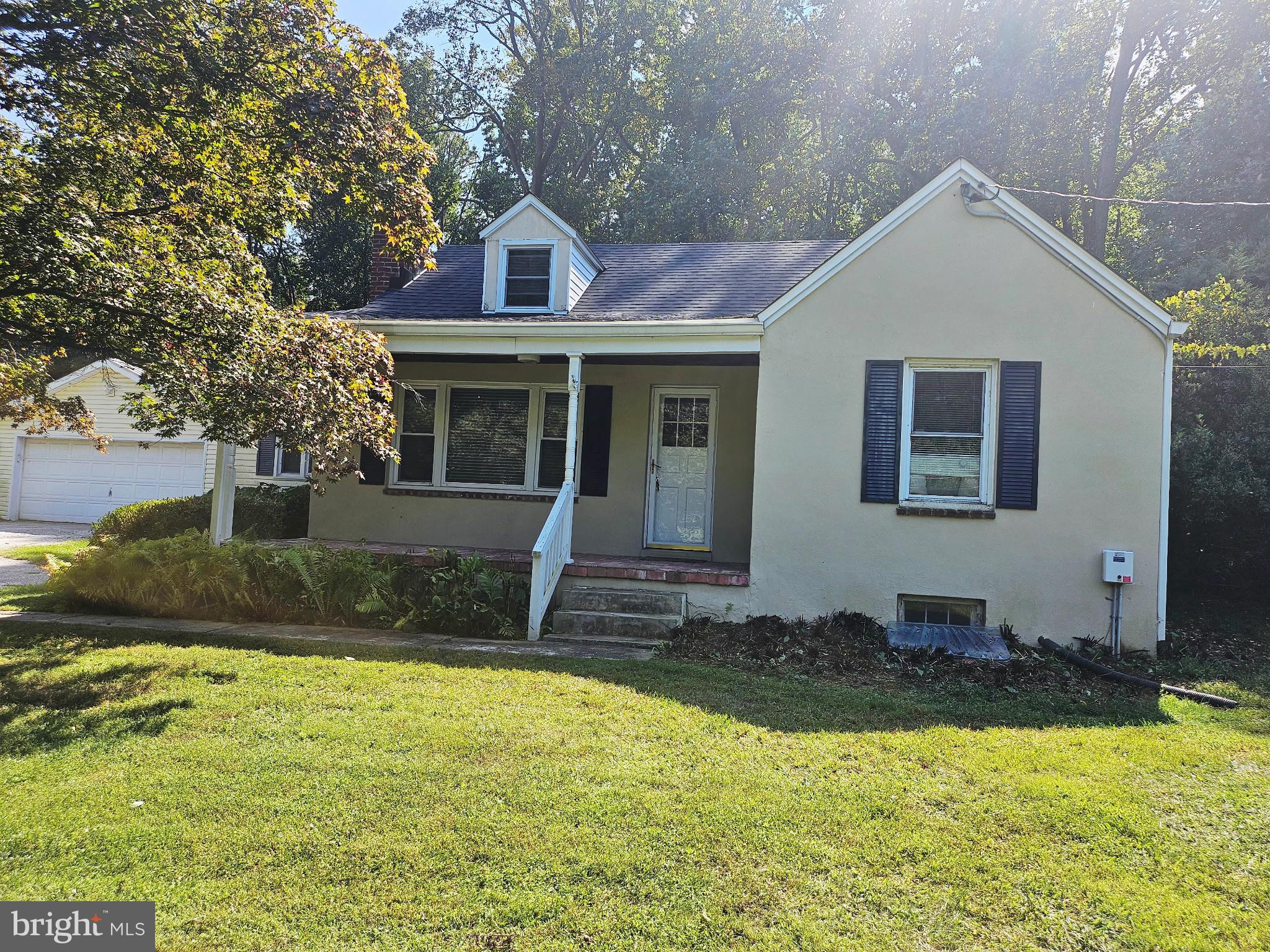 Enjoy this beautiful property with an acre of land located in Hunt Valley and backing to Oregon Ridge Park!
Convenient to Hunt Valley Towne Center, I-83, and Greenspring Valley, this charming cape cod has been well cared for with hardwood floors throughout.
It offers 3 beds, 2 baths, and a large two-car detached garage for parking, tools and equipment.
The classic living room has a cozy fireplace with pellet stove insert for those chilly evenings.
The kitchen has a cottage feel with white cabinets, white appliances and gray countertops.
Off the kitchen, there is a formal dining room as well as a sunroom.
The basement has a ton of storage and a rec room for multiple uses.
Serene backyard with a double sized lot and garden plots.
Roof, HWH, and HVAC (main level and bsmt zone 1) all replaced in 2021, waterproofing 2025, and updated windows.
This is an estate sale being sold “As-is”.
Ready to be called HOME!