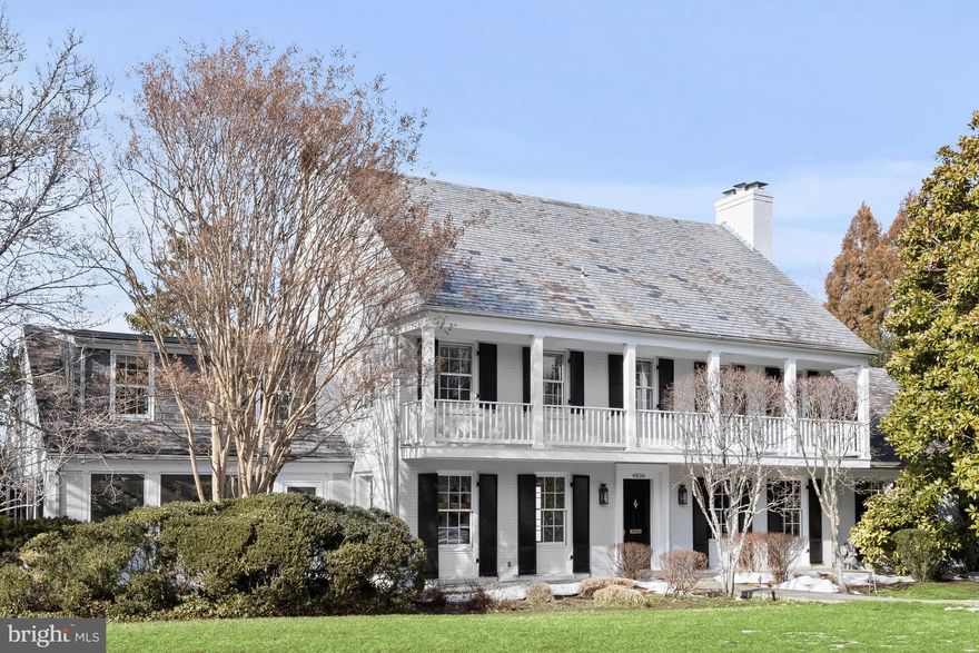 Beautifully sited on a rare and privately landscaped .41-acre lot in Spring Hill, this exceptional colonial offers refined living, grand entertaining spaces, and seamless indoor-outdoor flow in one of Bethesda’s most desirable neighborhoods. A gracious formal entry welcomes you into elegant living and dining rooms, each featuring its own fireplace, rich hardwood floors, and exquisite classic moldings. The dining room is further enhanced with detailed wainscoting, creating a timeless setting for gatherings both intimate and grand. The thoughtfully renovated chef’s kitchen is the heart of the home, designed with a generous center island, dual sinks, Wolf, Subzero, and Miele appliances, and abundant custom cabinetry. A spacious eat-in area and built-in desk space provide everyday functionality, while the kitchen connects effortlessly to an inviting family room with a gas fireplace and cathedral ceilings, perfect for relaxed evenings at home. Upstairs, the luxurious primary suite serves as a private retreat, complete with a walk-in closet and a spa-inspired ensuite bath featuring a soaking tub, separate shower, and dual vanities. Two additional ensuite bedrooms complete the second level, offering comfort and privacy for family or guests. The third floor provides exceptional flexibility with two additional bedrooms and a hall bath ideal for guests, offices, or creative space. The expansive lower level is designed for both recreation and practicality, featuring an ensuite bedroom, additional powder room, large family room with direct outdoor access, a dedicated workout room, and convenient access to the two-car garage. Outdoor living is equally impressive. The beautifully landscaped lot includes a screened-in porch and flagstone patio off the main level, plus a second flagstone patio from the lower level that opens to the expansive yard, creating multiple spaces for entertaining, play, or quiet relaxation. An extraordinary opportunity in Spring Hill.