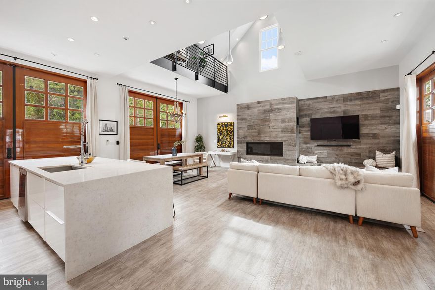 This captivating Craftsman home with modern guest house provides the ideal setting for celebrating the Eastport lifestyle and is in the best location for exploring  everything Annapolis/Eastport has to offer. The picturesque picket fence welcomes you onto the property and the front porch swing is the perfect place to unwind after a long day or have your morning coffee. The charming details from the 1920's are beautifully preserved throughout with the modern convenience of an updated kitchen, bathrooms and lighting fixtures.  The open floor plan creates a wonderful entertainment space and the spectacular kitchen with large island makes hosting large or small gatherings a breeze. The full bathroom and mudroom adjacent to the expansive rear deck is conveniently located to encourage the party to spill outside and creates the ideal setting for indoor/outdoor living all year round. Upstairs enjoy 2 bedrooms with soaring ceilings, exposed beams, beautiful finishes and the luxurious bathroom featuring double sinks, curated finishes and soaking tub with shower. The quaint garage has been converted to a stunning guest house with spacious main level featuring 2 story ceilings, fireplace with built-in bench/TV entertainment area, sleek modern kitchen with enormous island and powder room. Upstairs is a loft bedroom, walk-in closet and full bath with catwalk balcony overlooking the space below. The coveted off street parking space and an abundance of street parking is a rare find. This property is the perfect location for a permanent residence, weekend getaway home or rent one or both dwellings to generate income all year long. Stroll the artful and nautical streets to amenities like; five-star restaurants, pubs and street-end parks with hidden treasures. Not to mention you are merely steps away from downtown Annapolis and Naval Academy. Annapolis offers the perfect balance of small-town charm and big world sophistication. Located just 5 miles to Rt. 50 and 97 which provides direct access to Baltimore, BWI, Ft. Meade/NSA and Washington, DC.