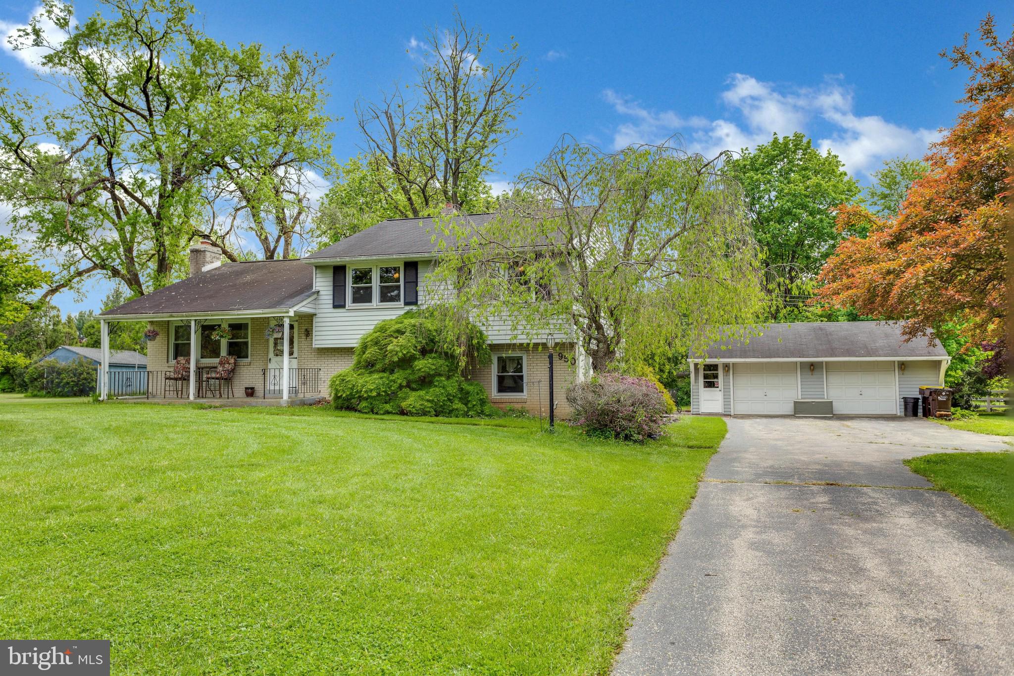 Welcome home to this charming mid-century split-level: just under 2000 sq ft, 4 Beds, 2.5 bath, situated on over a half acre lot. Walk through the front door into the spacious light-filled formal living room with a wood burning fireplace and original hardwood flooring. The hardwood flows right into the formal dining room, with large windows, wood paneling, and rear access to the covered deck and backyard patio. Completing this main level is a cozy eat-in kitchen with ample counter and cabinet space. Head upstairs to find 4 decently sized bedrooms, all with hardwood floors, ceiling fans, and generously sized closets, as well as one full bathroom. Included on this level is the master bedroom with its own additional private bathroom. The hallway is carpeted with hardwood underneath in pristine condition. Go up one more flight of stairs to the spacious attic, great for storage. The downstairs level consists of a massive carpeted family room, a conveniently located powder room, and a mudroom with updated porcelain tiled flooring, washer/dryer hookup, and access to the backyard. This property offers great curb appeal with a long driveway and a detached two car garage. It is located in the highly desirable zip code of Blue Bell, which includes the top rated award winning school district of Wissahickon, amazing shops, restaurants, parks, and close to all major highways for easy commuting. Request your showing today!