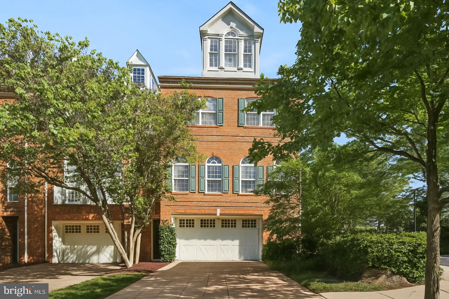 This rare and luxurious brick front end unit townhome offers 4 levels of perfection! Located in the gated community of The Vineyards of Annapolis, this is one of the largest homes in the community at over 3,100 square feet featuring a bump out on three levels, allowing ample sunlight to flow throughout. The main level is highlighted by a recent kitchen renovation that includes modern quartz counters, KitchenAid appliances with gas range, and a stylish herringbone tile backsplash. The tall ceilings, plentiful windows, open floor plan and hardwood floors in the living and dining room are the perfect combination to feel warm and inviting. The living room features one of two gas fireplaces (the other in the lower level) and access to the low maintenance, composite deck. Upstairs, the expansive primary suite offers vaulted ceilings, hardwood floors, a sitting area, and a generously sized walk-in closet. As you enter the luxurious ensuite bath you will find the perfect place to relax and unwind with dual vanities, a soaking tub, and a separate shower. Two additional bedrooms and a full hallway bath completes the upper level. The bonus loft space can serve as an additional bedroom, office, hobby room, or more. Downstairs you will find a versatile family room, an additional bonus room suitable as a fifth bedroom or office, and a full bathroom, giving you ample living space all around. The lower level includes convenient access to the attached two-car garage and a quaint brick patio, perfect for morning coffee. Don't forget about the convenient location due its ease of access to Route 50 and 97 and its proximity to many restaurants and shopping, including the Annapolis Towne Centre. This beautiful gem has it all!