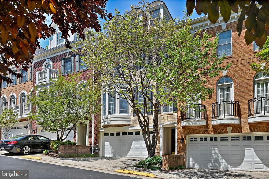 Welcome to this over 3000 sqf gorgeous condo townhome with details like Palladium Windows, iconic columns and a stunning spiral wood staircase accented by long suspended pendant light which illuminates the stairs from floor to floor.  Enter via garage, you are greeted with a rec room/guest suite or office with its own fireplace and full bath, it has direct access to veranda and back yard.  Main level's Open Floor Plan creates easy flow for entertaining from gourmet chef's kitchen to the great room to arched balcony.  Upper level 1 has a dramatic primary bedroom with vaulted ceiling, sitting area and a Juliet balcony.  All bedrooms are w/attached en-suite baths! Prime location near Tysons Corner, I-495 & Tysons Metro!  Fresh paint and kitchen floor refinished in 2025, Refrigerator and cooktop in 2022,  both HVAC systems in  2021, front load washer and dryer in 2019, roof was replaced by Condo Association in 2019.  Move in ready.