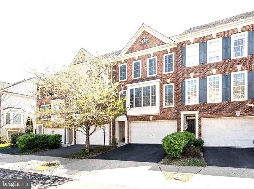 Spacious two car garage brick front townhome. Attached, front loaded two car garage with two additional parking spaces at drive way. Three levels townhome with walkout basement. The basement ->  fully finished basement, walkout to nice fenced backyard and plenty of space for gardening. The main level ->  hardwood floor with living, dining, sitting area, kitchen, powder room  and walkout to deck at back. The upper level -> three bed rooms, two full baths, laundry area with brand-new clothes washer and dryer.  The community -> two community pools, Gym and tot-lots, walking distance to Stone ridge public library, Stone ridge hospital, Harris teeter and shopping. Close to accessible roads (Route 50, Old OX Rd, Loudoun county parkway, toll roads, route 28 etc..) and close to IAD airport.