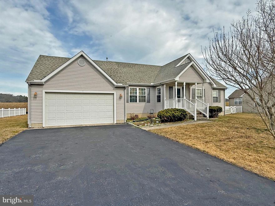 Less than 5 miles to the Lewes public beach, with the Cape Henlopen State Park beaches not much farther away. 8 miles to the Rehoboth Beach boardwalk. Community access to Red Mill Pond; drop a John boat in for fishing or take your kayak/canoe for an enjoyable day on the pond. Freshly painted and the carpets were just professionally cleaned. This 2002 custom-built home is 1,290 sq. ft. in the main house with a heated 12’x16’ sunroom for a total of 1,482 sq. ft. of living space – plus another 652 sq. ft. with the finished, partial basement. The living room features cathedral ceilings and a see-through gas fireplace, which can also be viewed from the kitchen and dining area. The kitchen and dining area have cathedral ceilings and skylights. Efficient L-shaped kitchen workspace. Appliances include a gas range, range hood, fridge with ice maker, and a dishwasher. There’s a pantry in the adjoining dining area. From the kitchen, a French door leads out the sunroom, which adjoins an open deck for your grill. The main bedroom is en Suite with a tub/shower. The other two bedroom share the second full bath in the hall, which also has a tub/shower. Full-size washer & dryer in the basement. Oversized garage with a workbench and shelving. Outdoor shower for after a day on the pond or at the beach. Central AC & ceiling fans, and warm gas heat. Small wall heater for the sunroom; The basement has electric baseboards so you can control the heat when you want it. Sump pump. Garage door opener. Outdoor storage shed. No HOA fee ($20/yr. voluntary dues). State/County maintained roads. Near all the resort amenities!