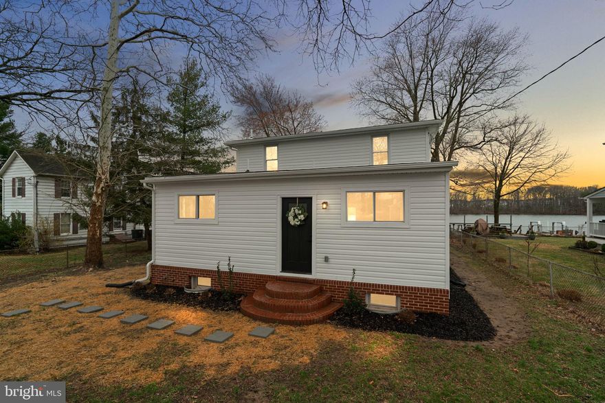 Welcome to a rare waterfront opportunity in Middle River—where peaceful living, beautiful water views, and modern upgrades come together in a newly renovated home that is simply stunning.

Perched on a quiet waterfront side street surrounded by long-time, well-maintained homes, this spacious three-level residence offers beautiful views of the bay and a lifestyle centered around the water. Oversized picture windows fill the home with natural light while capturing sweeping waterfront scenery throughout the day.

The main level features a large kitchen with sweeping water views, a dining room, and a living room designed for gathering and entertaining, along with a main-level bedroom and full bathroom. Upstairs, you’ll find three additional bedrooms—each with water views—and a second full bath. The finished lower level offers a recreation room, laundry area, another full bathroom, and flexible space that could serve as a fifth bedroom, home office, or playroom.

Boating and waterfront living are effortless here with deep water access from your private dock—perfect for kayaking, paddleboarding, crabbing, or heading out by boat to nearby waterfront restaurants like Bowley’s on the Bay.

This home has been extensively renovated down to the studs and fully permitted, offering the feel of a new build with updated electrical, plumbing, HVAC, roof, appliances, flooring, lighting, kitchen, and bathrooms.

An added bonus rarely found in this area: the sale includes TWO tax parcels, creating additional space, privacy, and long-term value. The additional parcel includes a large shed and significantly expands the property footprint.

Set on a large fenced lot with a huge covered patio overlooking the water and a finished basement rarely seen in nearby waterfront homes, this property offers the perfect blend of modern living and relaxed waterfront lifestyle.

Whether you’re looking for a primary residence, weekend getaway, or a home where every day feels like vacation, this is a waterfront opportunity you won’t want to miss.

NEW: 200 amp electrical service, plumbing throughout, HVAC system, roof, appliances, lighting, flooring, carpet, paint, kitchen, bathrooms, finished basement, and some new windows.