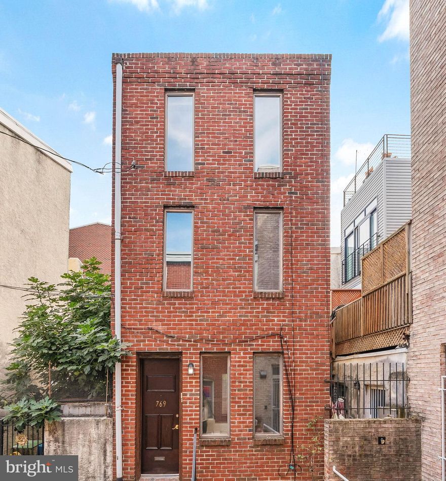Tucked away on a quiet, closed-end block in the heart of vibrant Bella Vista, you'll find 769 S 
Sheridan St. This move-in-ready 2-bed, 1-bath home has an updated kitchen, a private patio, a 
deck, central a/c, and a sought-after location just steps from top restaurants, friendly shops, and 
sprawling parks. The towering exterior features a classic red brick facade. Inside, you're 
welcomed by a bright and airy living room with gleaming hardwood floors, tall windows and a 
fireplace mantel. The sunlit kitchen features custom shaker cabinetry, black granite counters, a 
tile backsplash, a dishwasher, and a dining nook. Sliding doors lead to a secluded rear patio, 
ideal for barbecues and al-fresco meals. Up on the second level, there's a sunny bedroom with 
another fireplace mantel, a full bathroom, and a laundry room. The open third level is filled with 
natural light. Perfect for a bedroom, office, or home gym, this large space boasts tall ceilings 
and access to a peaceful deck. Completing the home is a clean basement offering extra 
storage. Utilities include central a/c, gas hot water, and gas forced-air heat. In addition to 
everything inside, 769 S Sheridan St's fantastic location earns a Walk Score of 98! Bella Vista is 
a lively neighborhood filled with friendly residents and lots to explore. Just around the corner, 
Cianfrani Park hosts community events throughout the year. This home is also a short stroll 
from E Passyunk Ave, 11th St, Washington Ave, and the 9th St Italian Market. Plus, there's easy 
access to public transit, Pennsylvania and Jefferson hospitals, Center City, I-95, and South 
Jersey. Schedule your tour today!
