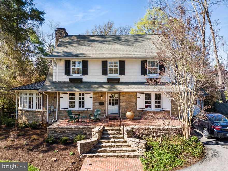 5 Ogden! Oh, what a beautiful home! With a deep front lot (.36acres in total), this classic Swarthmore stone center hall colonial oozes with charm and character. It starts at the front stone steps and brick patio and continues to the formal foyer. The formal living room, off to the left of the foyer, extends front to back, with French doors to the back patio. This room shows off the lovely hardwood flooring that is throughout the home and features an elegantly mantled stone fireplace with original Mercer tiles. You enter a sunroom from either side of the living room fireplace, where a serene, retreat awaits. The entire sunroom curves around a second wood paneled fireplace and mature landscaping outside keeps this room warm and inviting. Finished terracotta flooring adds to the appeal, and there is a seamed copper roof above. Flowing through to the formal dining room on the left of the foyer, notice the deep windowsills, corner hutch and crown molding and entry to the kitchen. The kitchen is a true cook’s joy! A custom paneled refrigerator, stainless wall ovens, gas cooktop and custom tile backsplash make cooking easy. And a large breakfast area sits under a panel of windows to the patio. A fantastic and unexpected mudroom is open to the kitchen and adds so much! Do not miss the hidden laundry chute, potting counter with copper sink, desk, and floor to ceiling cabinetry. There are so many ways to use this space! 
The primary bedroom on the second floor has much to offer as well! Flooded with light from the front and back and anchored by custom built in bookcases at either end, this beautiful bedroom includes a small step-down sitting room and spacious ensuite Bath complete with shower, soaking tub, double bowl sinks, custom cabinetry, walk in closet, and the laundry chute to the mud room.  This is truly a joy and such a surprise in a home of this age! There are three generously sized secondary bedrooms, one with Hall Bath access. 
The third floor includes a finished yoga studio/office/fifth bedroom with skylights and carpet.  A large storage room is on this floor as well. 
The finished basement is a perfect rec room with a painted floor, storage cabinets, a linen closet and laundry area tucked away behind louvered doors.  An unfinished area includes a utility sink and ample shelved and open storage space. NEW gas HVAC, gas hot water. 
The tile and flagstone patio is accessed from the living room and mudroom and is terraced, leading  up to sheltered dining area under a wisteria pergola. Fencing surrounds the back yard for the family pets.  And there is interior access to the garage from the kitchen as well.
With curb appeal abounding, 5 Ogden Avenue enjoys all that Swarthmore has to offer with fair, food truck and parade days so much fun. And, of course, the local shops, public Library, Swim Club, CO-OP grocery store, and train station. Served by prestigious Blue Ribbon Wallingford-Swarthmore schools, you are just twenty minutes from Philadelphia International Airport by car, and thirty minutes from downtown Philadelphia or Wilmington. 
Beauty and history seeped in carefully curated landscaping.   Just one visit and you won’t want to say goodbye!
And for another look, watch the video, attached. Floorplans are on their way!