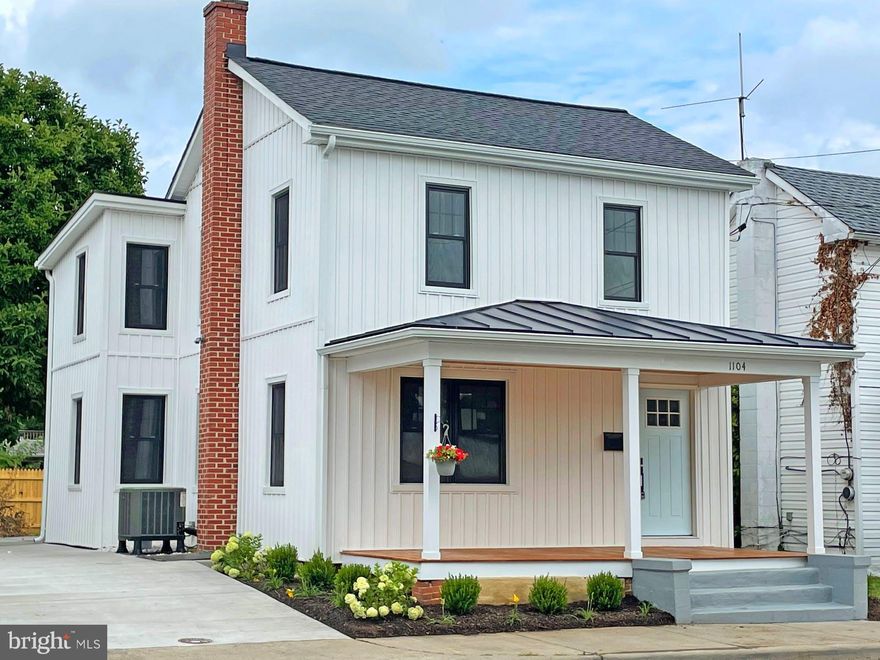 Open house on 7/24 is CANCELLED.

Irresistible with modern farmhouse style, this 1922 Folk home is cheerfully polished just moments
from downtown Winchester. Walkable to the Patsy Cline home, this remodeled bitesize beauty brings
to life 1,688 square feet of living where historic detail blends with crisp colors, handsome trim,
refinished rustic floors, and eye-catching stone. While the home’s exterior welcomes with
on-trend vertical vinyl siding, new windows, metal roof, and organic adornments, you’ll find the
gourmet kitchen equally inviting; inspiring gatherings with neighbors surrounded by gorgeous
soft-close cabinetry, LG appliances, and fixtures reflecting light onto an artful quartz-topped
island. Here, complete party-perfect bites and weeknight meals, then gather in the living or dining
space for fun with friends.  While three sunny bedrooms and one and a half dazzling baths are
restful retreats, you’ll appreciate top-floor laundry, loft for working or play, and outdoor spaces
for sipping summer drinks. An enviable slice of small-town living, ask about updated utilities, and
note two-car off-street parking.  From home, enjoy strolling to favorite shops, eateries, and
annual festivals, while nearby, golf clubs, vineyards, and Shenandoah adventure can’t wait to entertain.