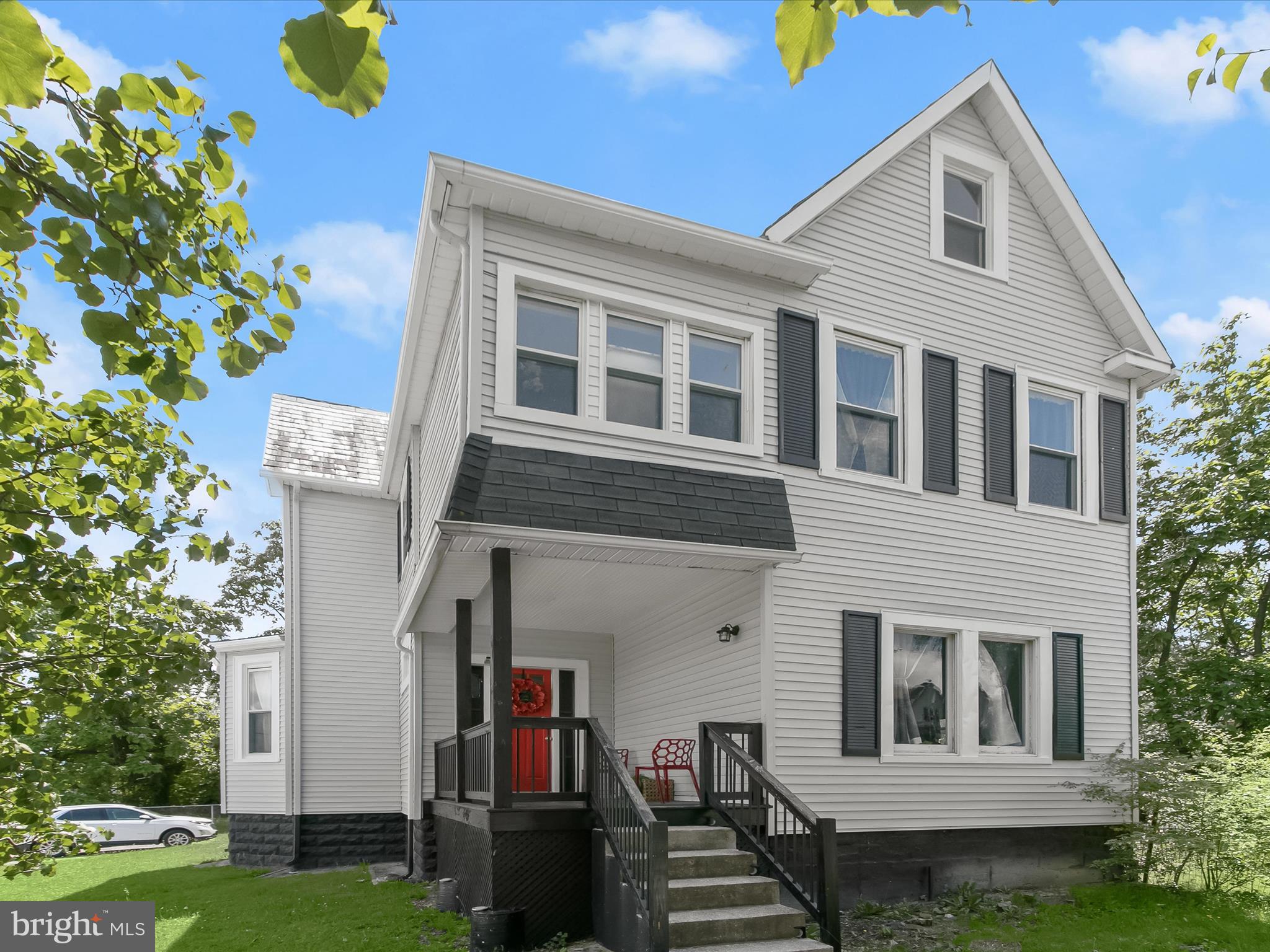 Welcome to your dream home — a meticulously renovated 3-bedroom, 2-bath Craftsman-style residence perched on a generous corner lot. Spanning three beautifully finished levels, this home seamlessly blends classic charm with modern updates.
From the moment you step onto the covered front porch, you'll feel the warmth and character that sets this home apart. Unique stained-glass transom windows above the front door and living room windows add a touch of timeless elegance.
The sun-drenched main level features a spacious living room, a cozy sitting area, a fully remodeled full bath, a formal dining room, and a show-stopping kitchen. The kitchen is a true centerpiece, complete with abundant cabinetry, double pantry, stainless steel appliances, quartz countertops, and a large island with deep stainless sink and breakfast seating.
Each floor showcases newer carpeting and luxury flooring, enhancing comfort and style throughout. Upstairs, you'll find a spacious primary bedroom, two additional bedrooms, and a sleek, modern bathroom with a walk-in shower. A bonus room on this level is perfect for a home office, or creative space.
The third floor offers even more flexibility, with a charming loft-like space featuring vaulted ceilings and an exposed brick chimney — ideal as a guest room, studio, or quiet retreat.
The unfinished lower level provides tons of storage, above-grade windows, and convenient access to the fenced backyard through Bilco doors. Step outside from the kitchen to a lush, open yard — perfect for gardening, play, or outdoor entertaining.
This move-in ready home is packed with thoughtful upgrades including recessed lighting, ceiling fans, and quality finishes throughout. All this, just minutes from shops, dining, and major commuter routes.
Don't miss the opportunity to own this beautifully crafted, turn-key home filled with character and modern convenience!