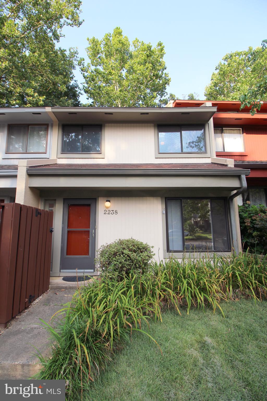 Experience refined townhouse living in the heart of Reston with this beautifully maintained 3-bedroom, 1.5-bath residence. Spanning approximately 1,176 square feet, this thoughtfully designed home offers a harmonious blend of comfort, functionality, and outdoor charm.
The main level welcomes you with a ceramic-tiled foyer and a spacious living area. Living room/dining/kitchen features a "luxury" vinyl plank flooring - easy care! An expanded and renovated powder room includes a bonus shower. A well-appointed kitchen offers ample cabinetry, Formica countertops, and a complete appliance suite—including an electric range, dishwasher, and full-size refrigerator—seamlessly connected to a dedicated dining area. From here, sliding glass doors open to an expansive, brick-paved patio and private fenced yard, complete with generous exterior storage—ideal for effortless indoor-outdoor living.
Upstairs, the home features three serene bedrooms with plush new carpet underfoot, including a rear-facing primary suite with a walk-in closet. The full bath is elegantly finished with ceramic tile, a glass-enclosed shower, and a wide vanity. A second hallway storage closet adds convenience, while the in-unit laundry and mechanical room includes a full-size washer/dryer and electric systems for comfort and efficiency.
Two assigned parking spaces provide ease of access, and residents enjoy the benefits of the Reston Association’s extensive amenities. Next to Dogwood Elementary School. This turnkey home is ready for immediate occupancy. Positioned minutes from shopping, parks, walking trails, multiple Metrorail stations, and major commuter routes...etc. A Fairfax Connector bus stop is at the entrance of the community.
During the application process, any additional fees and disclosures will be provided before application submission to help ensure transparency. Credit reporting is part of your lease and may increase your credit score up to 40 points over 12-24 months if rent is paid on time.