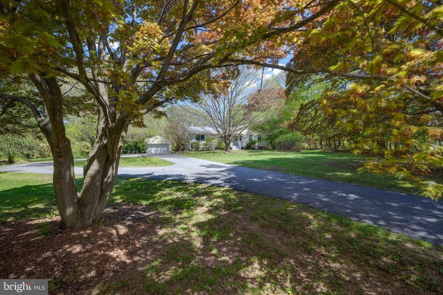 Live authentically. Thoughtfully updated rancher nestled off a private and paved circular drive in highly coveted Monkton. Soak in the seasons on the new back porch that overlooks the wide open and flat backyard. Serenity abounds. First floor has been opened for seamless flow and modern day ease of living. Beautiful white oak floors. Enjoy quiet reading or morning coffee in the screened-in porch with views of the lush landscape. Delight in cooking while enjoying family and friends around you. Easy access from the kitchen to the outdoors for grilling under the stars. Lower level hang out space freshly painted with brand new flooring. Several system updates have been made over the last five years including a new septic system, new air conditioning unit, new hot water heater and a new holding/pressure tank. An opportunity to blissfully enjoy the Monkton lifestyle. Convenient Hereford location. Cultivate your existence.
