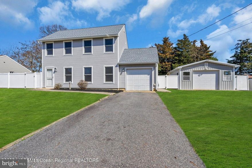 Charming and move-in ready, this 3-bedroom, 2-bath home in the desirable Atlantis section has been beautifully updated for today's lifestyle. Enjoy durable vinyl plank flooring throughout the main living area, a newly remodeled kitchen with crisp white cabinets and granite counters, plus two fully renovated bathrooms with fresh, modern finishes. Stay comfortable year-round with new mini splits for efficient heating and cooling. The home sits on a great-sized lot with plenty of outdoor space and includes a huge DETACHED GARAGE/WORKSHOP—ideal for storage, hobbies, or projects. LOW UTILITY BILLS