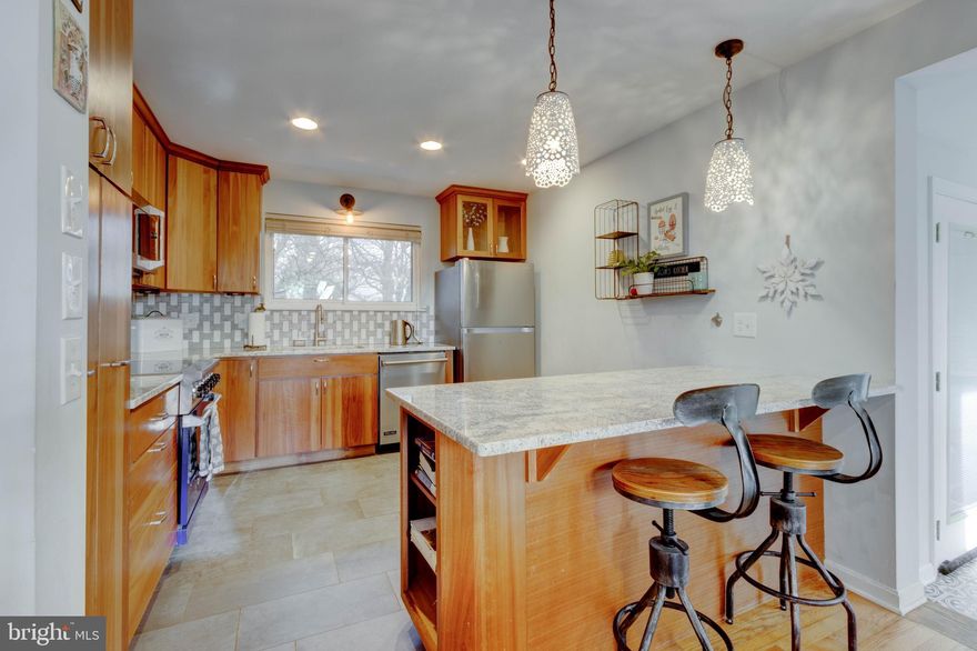 Captivating custom Cape Cod with tons of personality and unique floor plan that lives smart for so many lifestyles! Steep roof pitch allows for cathedral ceilings, recessed lights and skylights which allow natural light to dance thru the hardwood flooring and multiple living areas. Pellet stove heats up a cold day and makes for cozy couch days. Main level bedroom or office has full bath right there, multiple living areas all open out to deck access and serene park-like flat fenced yard abutting sod farm open space.  Spectacular outdoor living!
Like to cook and entertain? Well, this gourmet kitchen has granite counters, gorgeous cabinetry, stainless steel appliances, wine frig, oversized farm ceramic sink, and yes a VIKING STOVE! Upstairs are 3 great size bedrooms, nice bath and open hall with soaring ceilings. The basement is a blank canvas for your dream plans or just storage with an outside exit. Almost a three car garage, it currently has an access to go up to a 5th bedroom or studio or you could remove it for larger cars.
Burley has an active social voluntary association that features a great beach, playground and a first come first serve boat slip dock for $50 a year. If you need a boat slip the fees run $500-1000/year. Annapolis address but desirable Broadneck Schools. Minutes to downtown but down a pastoral scenic road of Pleasant Plains. Runners and walkers love to use the open spaces-field of dreams. A traffic light at Old Mill Bottom and St. Margarets and another traffic light at Pleasant Plains and St. Margarets is approved and budgeted for 2023. Enjoy an Easy commute to the Naval Academy or downtown Annapolis via sleepy St. Margarets Road without any road rage.