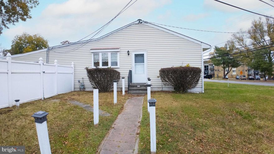 One-level living at its finest! A true 4 bedroom, 1.5 bath rancher is ready for its new owner. Recently painted and new flooring installed throughout. The additional family room area has a vaulted ceiling, half bath, and looks into the separate dining area. An open kitchen window allows one to be involved in the party while still preparing meals. Upgraded windows, vinyl siding, and central HVAC. Large addition in the back could be used as an additional bedroom/living room combo, playroom, or office area. Tons of opportunities for that space. The vinyl-fenced backyard is huge, with plenty of space for entertaining or outdoor activities. 6-car parking pad/drive pulls right in to access the back entrance privately. Remodel the current garage to increase the parking even more. Extremely close to all shopping, restaurants, and major roadways. Schedule your appointment today!