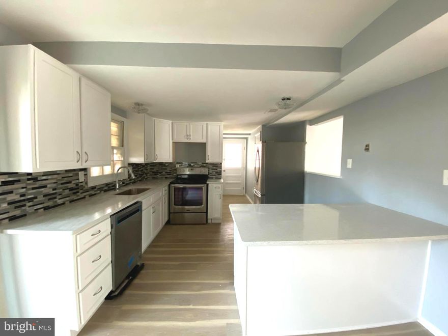 Multiple offers, highest and best due 12/26 12pm***Beautifully renovated duplex ! Must see!!Numerous upgrades throughout!! Fresh, neutral paint! New wood laminate flooring  on main level! New carpet on upper level! New Thompson Creek windows throughout! Updated lighting!  Remodeled kitchen with new cabinets,gorgeous backsplash, updated stainless steel appliances, and granite countertops! Half bath on main level! Oversized storage/Pantry ! Upstairs has plenty of room with 4 bedrooms with 1 full and 1 half bath! Updated full bath with ceramic tile, Fenced backyard, carport! Clean and neat! Vacant and ready to go! Easy access to Marc train, Rte 32, Rte 100, Ft. Meade, NSA, Washington DC! Show and sell!