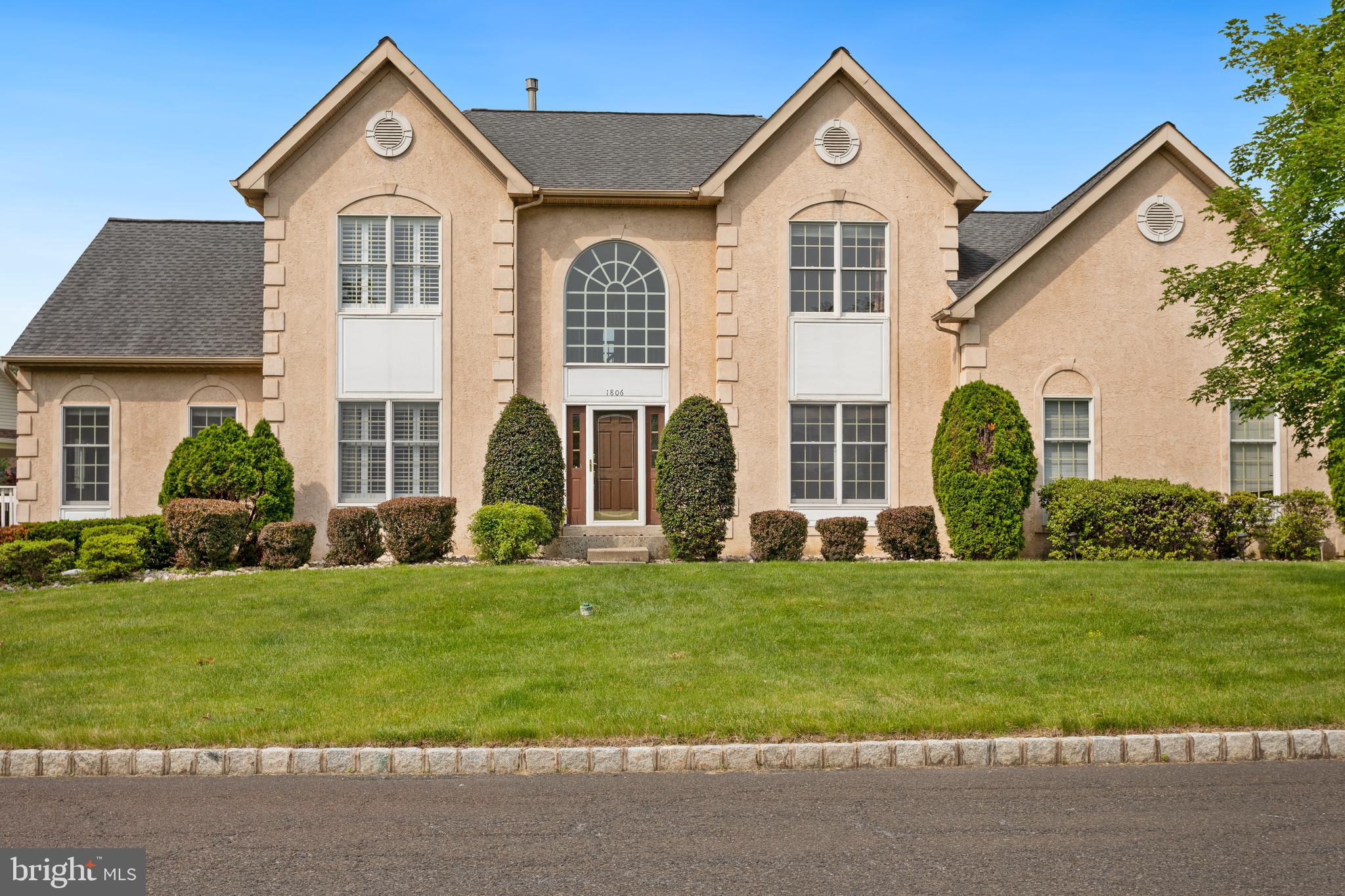 Professional Photos Coming Soon!
Nestled in the prestigious Estates of Bucks County Country Club, this expansive 5-bedroom, 3.5-bathroom residence offers over 3,800 sq. ft. of luxurious living space. The grand two-story foyer welcomes you with gleaming hardwood floors, an inviting formal staircase and beautiful windows. Elegance flows through the formal living and dining rooms, adorned with architectural columns and custom moldings, creating the perfect ambiance for entertaining. A private study with double doors provides an ideal space for a home office or library. The gourmet island kitchen is a chef's dream, featuring 42" cabinetry, a tiled backsplash, built-in desk, pantry, and a cozy breakfast area. A side door leads to a spacious deck, seamlessly blending indoor and outdoor living. The spacious great room boasts a cathedral ceiling and a brick fireplace, offering a warm and inviting atmosphere. A standout feature of this home is the first-floor in-law suite, complete with a sitting area, bedroom with private deck access, walk-in closet, and a full bath with a shower—perfect for multi-generational living. Upstairs, the master suite offers a double-door entry, his-and-her walk-in closets, a dressing area, and a private sitting room. The luxurious master bath is a retreat, featuring a soaking tub, double sinks, and a beautiful stall shower with seamless glass enclosure. Three additional spacious bedrooms on the second level provide ample closet space and share a well-appointed hall bath. The full basement is ready to finish with potential for a home theater, gym, or recreation area. A side-entry 2-car garage adds convenience and ample storage. Modern amenities include 9-foot ceilings on the first floor, dual HVAC systems, and a wood-burning fireplace. Recent upgrades include a new roof installed in 2018, along with renovated kitchen and bathrooms, ensuring a move-in-ready experience. Situated in a sought-after golf course community with access to top-rated schools and close proximity to shopping, dining, and recreational facilities, this home combines timeless elegance with modern conveniences, offering an exceptional living experience.