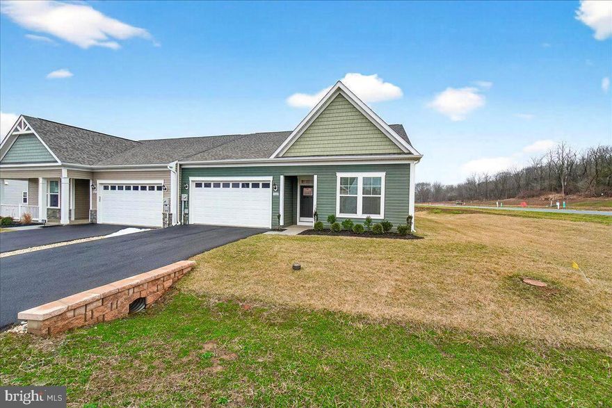 Like buying new but without the hassle and wait. Single level living at its finest in the 55+ active adult community of Rosehill Manor that includes a pickleball court, trails and a nice dog park. This home is situated on a corner lot and features 2 bedrooms. 2 baths plus an additional large room that can serve as an office, den or extra storage. The primary bedroom suite includes two walk-in closets, attached bath with double sinks and a walk-in shower with seat. Smart open floorplan with high ceilings, crown moldings, recessed lighting, large windows and bedrooms situated on opposite ends of the home providing great privacy. The kitchen is gorgeous with huge island for entertaining, lots of cabinet space, high end quartz countertops, double wall ovens, five burner gas cooktop and large capacity refrigerator. There is also a convenient laundry/mud room accessible to a two-car attached garage.  Utilities include a tankless gas water heater for endless hot showers, Lennox gas furnace and AC. Virtual staging used in some photos.