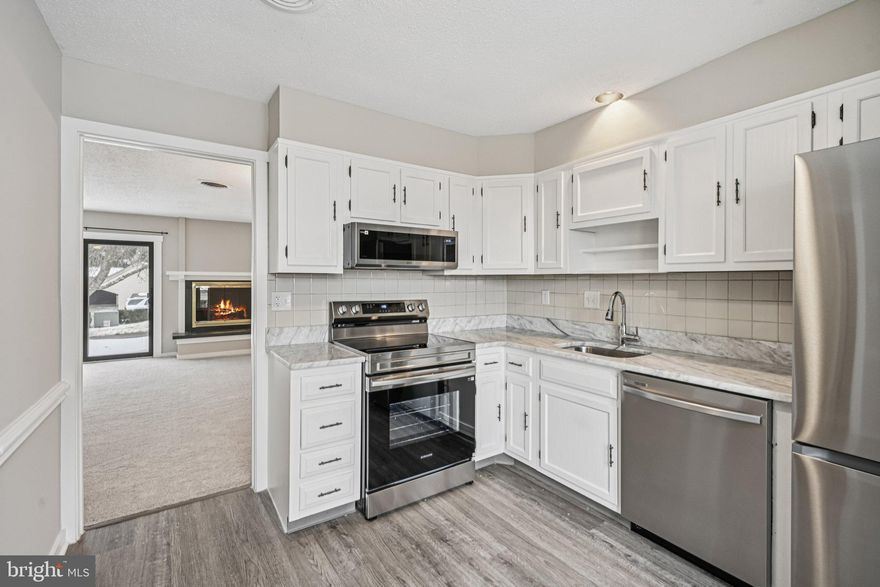 Nestled in the desirable Ashton Village section of the extremely popular Hershey’s Mill community, this lovely 2 bedroom / 2 bath home at 46 Ashton Way offers the perfect blend of comfort and active adult living.  Enjoy spacious, light-filled interiors and a layout designed for both relaxation and entertaining. The spacious primary bedroom with ensuite updated bathroom  offers a great retreat while the 2nd bedroom offers additional options for your personal needs. The Open Floor plan allows you to create a living space that works for you .... whether you choose to enjoy evenings by the cozy fireplace , entertain gatherings of all sizes.... or visit with friends on your private  outdoor patio.   Living here offers so much more than just a home; it’s a lifestyle, with access to world-class amenities including golf, tennis, swimming  and more, as well as many community activities and miles of walking trails, all within a secure, gated environment in the heart of West Chester. This property also includes a personal carport for ease of parking.  Recent improvements to the home include fresh paint, new carpeting, new stainless steel kitchen appliances and bathroom updates in 2026,  new sliding doors in 2025,  new roof in 2022 as well as new  HVAC System, Hot Water Heater,  Electrical panel  and new windows all installed since 2019 giving a new homeowner peace of  mind. Conveniently located to restaurants, shopping, entertainment and more, 46 Ashton Village is  just minutes to downtown West Chester, where you can take advantage of the vibrant downtown activities, or just a short drive to all of the shopping and amenities at The Main Street at Exton.   This is a wonderfully , well maintained home in a fabulous community.... book your appointment today!