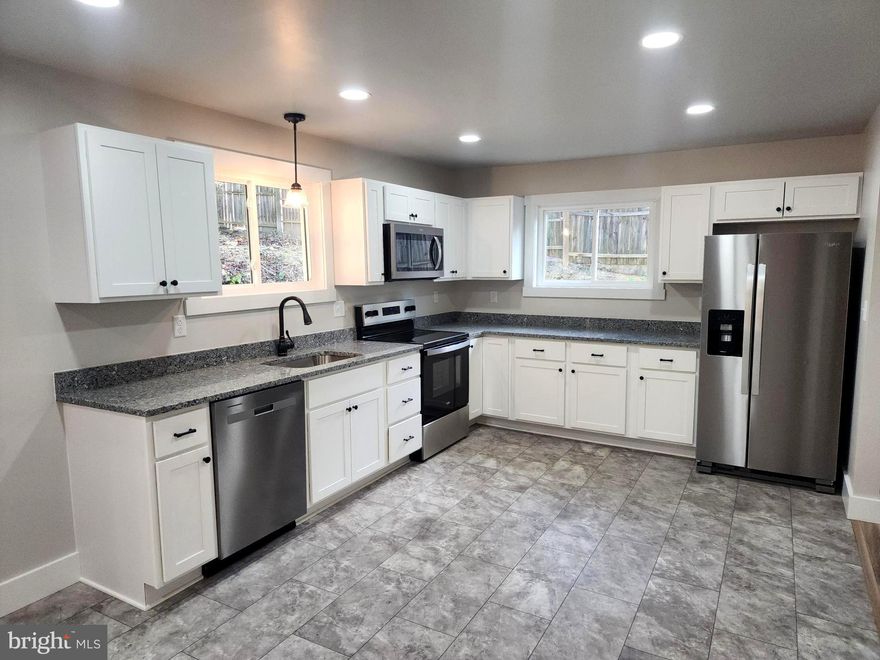 Total Makeover! Beautifully Renovated & Move-In Ready Welcome to this fully remodeled 3-bedroom, 2-bath home offering 2,000 square feet of stylish and comfortable living space. Every detail has been updated—from the new roof, flooring, and kitchen, 2 updated baths, HVAC and central A/C, siding, electric service, water heater, windows, and door—giving you modern comfort and peace of mind. Enjoy the upgraded kitchen featuring sleek stainless steel appliances and elegant granite countertops.  Additional features include: All kitchen appliances convey, ample parking, additional lot included. A 3rd lot at an additional cost with stunning view of the city.  A full basement partial finished with full bath and balance ready for your plans. Whether you're hosting guests or enjoying quiet evenings at home, this property is move-in ready and waiting for you. Don’t miss out—schedule your private tour today!