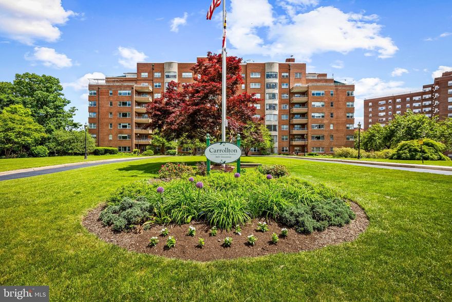 Welcome to the Carrollton! This stately brick condominium is beautifully cited on a lush radiant level lot which front on the Guildford Gateway Park, a Park given in honor of visionary developer Edward Bouton. Equally inviting is the elegant lobby, with floor to ceiling windows. Take a short ride on the elevator to unit 705.  Warm and inviting from the minute you walk in the door – updated kitchen, parquet wood floors, built-in bookshelves and  enchanting porch with new terra-cotta floors, ideal for morning coffee, Wordle, and stargazing. Large living room can accommodate so much. Intimate dining room, two spacious bedrooms and two lovely bathrooms with classic black-and-white basket weave flooring. Deeded garage covered parking. Full service building with helpful knowledgeable staff. Minutes from the excitement of Charles Village - eateries, breweries, coffee shops, and more. Easy to call home and enjoy!
