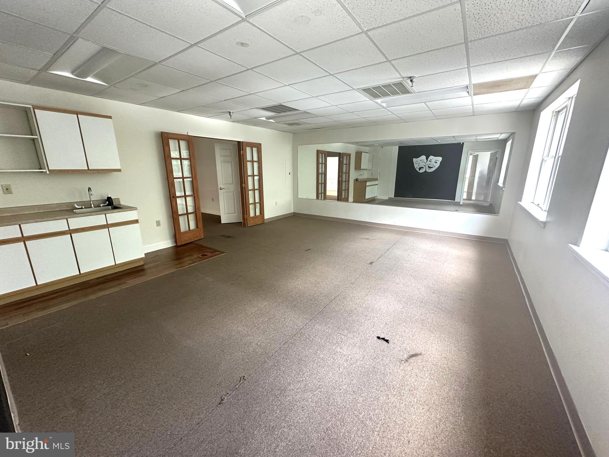 Approximately 1,336 sq. ft. of second-floor office space available in the highly recognized "Potomac Square" shopping center. This suite features a mostly open layout with three spacious rooms and a small kitchenette. Conveniently located near the rear stairwell and parking lot for easy access to your suite. The suite shares four ADA-compliant restrooms with other second-floor tenants, and elevator access is available for added convenience.
Tenant Responsibilities: NNN expenses: $653.53/month (in addition to base rent); Utilities: Electric, cable, quarterly $45 water bill ; Janitorial service within the suite
**Mirrors in the space to be removed**