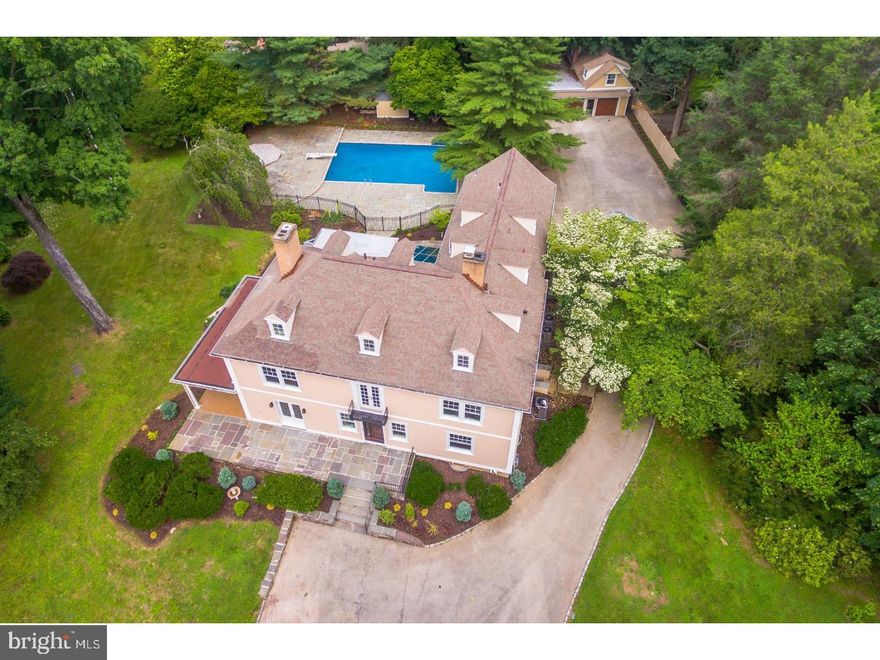 Town and Country Living in the heart of Bryn Mawr! Enjoy the best of all worlds in this newly renovated regency colonial on nearly 2 acres in the coveted north side of Bryn Mawr. With over 6,000 sq. ft. of living space on three floors, this late 19th-century masterpiece features 7 spacious bedrooms, including a master suite with sitting area and fireplace, plus 5 full baths and 1 half bath, all with new plumbing, marble tilework, new furnishings and Kohler fittings. Ideal for entertaining, the designer chef's kitchen features Clive Christian cabinetry and stainless steel appliances, including a professional Viking range with 2 ovens, 2 built-in Bosch dishwashers, Viking professional built-in refrigerator, wine cooler, plus a Brazilian quartz island, breakfast nook and more. New oak floors complement original details like crown molding, elaborate millwork, built-in shelving, leaded glass doors and 10-ft. ceilings. A wall of glass doors overlooks a flagstone patio surrounding a huge in-ground swimming pool. Every inch of this magnificent home has been renovated including a new roof in sections, new windows, new floors as well as the stucco exterior. A 4-bay garage can house up to 8 vehicles or accommodate a workshop. Within walking distance to the upscale boutiques and fine dining in Bryn Mawr!