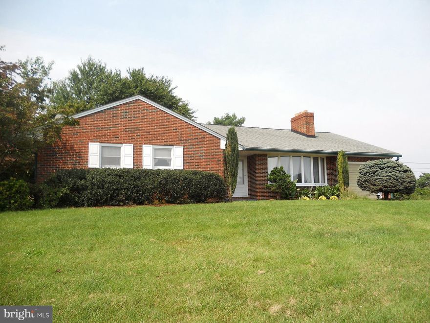 CLASSIC BRICK RANCHER on 1 acre, 3 Bedrooms, 3 Bath. Hardwd flrs, sunken liv room with bay window, open liv rm/ dining rm/sun rm w/lots of natural light. Wood burning fireplace in liv room and low lev rec room. New electric cook top, eat in kitchen, new carpet in sun rm. Screened porch and private rear yard. Beautiful country view, 1 car gar, radon system, AHS Home Warranty. Pool/shed sold as is.
