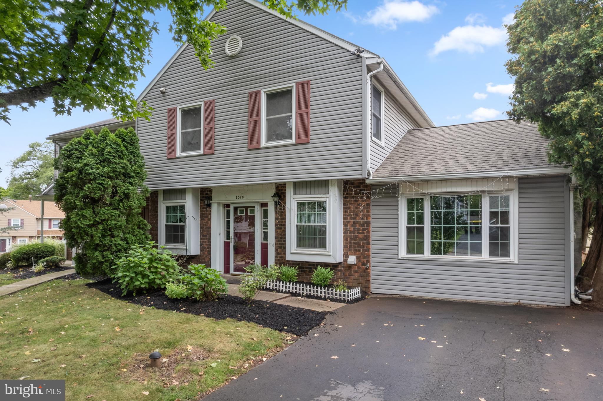 Ready for your amazing rental opportunity on a quiet cul-de-sac street in the highly desirable Green Valley neighborhood! This Towamencin Twin is in great condition, in a great neighborhood, in the high demand North Penn School District and close to everything being just off of Sumneytown Pike (Rt 63) and minutes from the Lansdale exit of the NE Extension, with quick access to shopping, restaurants, breweries, schools and so much more! As you pull up to this home you will notice the well manicured lawn and flower beds, and as you enter you are greeted by vinyl plank flooring throughout almost the entire first floor. Your kitchen was recently updated with room for a small breakfast table, newer cabinets, quartz countertops, tile backsplash, stainless appliances, and natural gas cooking. The dining room is just off of the kitchen and features chair rail and shadowbox trim and can easily hold a table for 6-8 people. The living room is massive with its chair rail and shadow box trim as well and with a sliding glass door to your covered back patio this is an amazing space to entertain family and friends. Your laundry room (with washer and dryer) and stylish half bath are just off of the foyer and winding out downstairs is a bonus family room with fireplace and wall to wall carpet and could be an amazing office, craft room, work out space or study / game space for the entire family! Heading upstairs you’ll find a wonderfully updated spacious full bath with walk-in shower that is perfect for family and guests plus two generously sized bedrooms (one BR has pull down stairs for attic access) with wall to wall carpeting! And the primary bedroom is massive with a walk-in closet and en-suite full bath with ceramic tile floors. This efficient home has central air and forced air heat. And your wonderful level back yard with raised garden beds ready for growing fresh vegetables! So if you’re ready for a clean, spacious rental for your family welcome home to 1578 Yeakel Way in Lansdale! This is a no smoking and no pets rental. All applications should be submitted through rentspree. **Professional photos should be uploaded shortly. **
