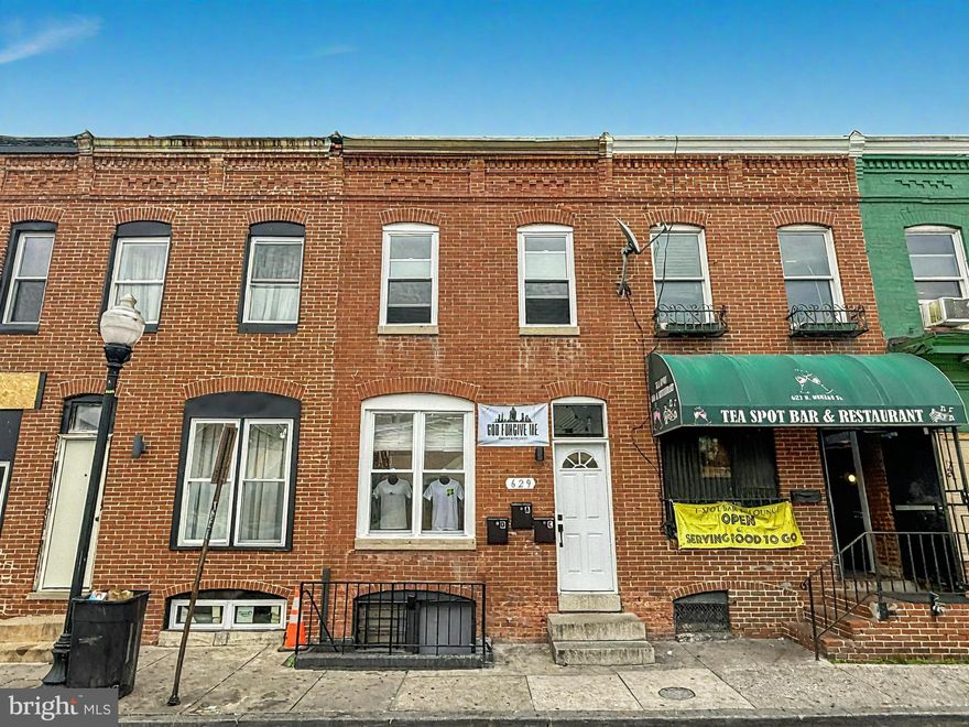 Must Sell! Rare opportunity for a homeowner to live upstairs and generate income below in this fully renovated mixed-use property just half a block from Johns Hopkins Medical Campus. This building qualifies for 3.5% down FHA financing with over 51% of the floor area dedicated to residential use—ideal for an owner-occupant who wants to live upstairs in the beautifully updated 2BD/1BA apartment featuring granite countertops, stainless steel appliances, recessed lighting, exposed brick, and new flooring (previously rented for $1,450/month), while offsetting the mortgage with two income-producing commercial spaces—or by running their own business on-site. The main-level storefront is leased to a retail apparel shop for $450/month and features exposed brick, updated flooring, ceiling fan, an improved fireplace mantle, and a new half bath. The renovated lower level includes new flooring, exposed brick, updated lighting, and a full bathroom—ideal for a coffee shop, salon, office, or boutique—with projected rent of $800–$1,000/month. The building was fully renovated less than two years ago and includes three separately metered HVAC systems, a new roof, a privacy fence, and a newly poured concrete pad. Located in the busy Monument Street business corridor, the property sits in a rapidly developing area near Johns Hopkins, with major investment in new research, residential, and commercial facilities including the Science + Technology Park and planned Life Sciences buildings—making this a smart live/work opportunity with long-term upside.