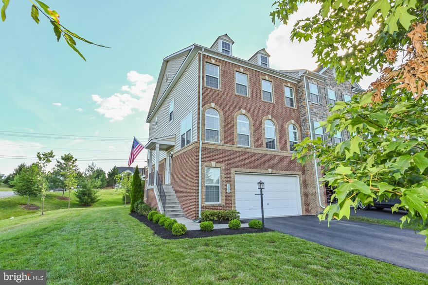 The word luxury comes to mind in this stunning brick front, end unit  Middleton II model with all the fantastic upgrades! You are welcomed into this beautiful home by the rich 5 inch hardwood flooring. Stepping into the gourmet kitchen, you will be wow’d by the  newly redone high-end cabinets, butler’s pantry with glass doors, upgraded stainless steel appliances including double wall ovens, 5 burner gas cooktop stove, new microwave, the whisper quiet dishwasher, motion activated faucet with the large deep sink, glass tile backsplash and the gorgeous quartz countertops. The Palladian windows fill the home with light! The open floor plan provides easy access from the kitchen to the family room, formal dining & breakfast areas as well as to the large deck for morning coffee or barbecues! The large master bedroom has a great walk-in closet with closet organizers. The tiled master bath has double vanities, glass shower and soaking tub. The walk-out basement has a guest suite and full bath. The new washer and dryer are on the bedroom level making life easy. Being conveniently located near Wegmans and all that the Village at Leesburg offers, the Outlet Mall, Home Depot and Costco, life cannot get any better than living at 1559 Kinnaird Ter NE!