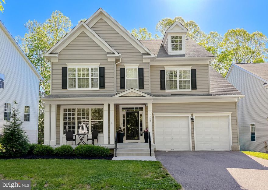 Welcome home to this beautifully updated colonial nestled in the heart of Wildewood! Offering 4 spacious bedrooms and 3.5 bathrooms, this home provides the perfect blend of comfort, functionality, and modern style. Step inside to a grand foyer that opens into a bright and open space, highlighted by elegant details like wainscoting and chair rail. A versatile front room offers the flexibility for a formal living area or home office. The layout flows effortlessly into a formal dining space and an inviting eat-in kitchen, recently refreshed with a stylish facelift, modern finishes, and top-of-the-line smudge-proof stainless steel appliances. New flooring throughout the entire home adds a fresh, cohesive feel. Just off the kitchen, the cozy family room with a gas fireplace opens to an enhanced outdoor living space complete with a spacious covered deck with stairs down to the patio area - perfect for entertaining or relaxing while enjoying the peaceful, tree-lined backyard. Upstairs, the primary suite is a true retreat, featuring two closets and a beautifully renovated en-suite bath with a soaking tub, separate shower, and dual-sink vanity. 3 additional generously sized bedrooms, a full bath, and a convenient laundry room complete the upper level. The finished basement offers endless possibilities with a large recreation area, additional flex space currently used as a 5th bedroom, full bathroom, and plenty of storage. Additional upgrades include updated light fixtures throughout the main and upper levels, custom blinds, a home security/alarm system, and a heavy-duty storm door. Tucked away on a quiet street, yet just minutes from shopping, dining, and Pax River NAS. This home truly has it all. Don’t miss your chance to make it yours!