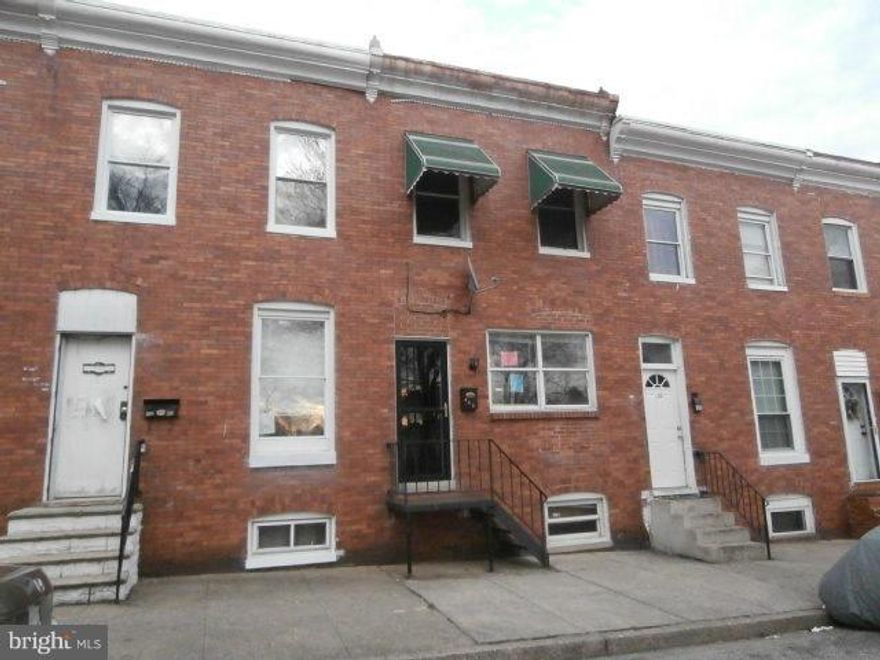 Three level brick town home has 3 bedrooms and 1 bath on upper. Upgrades in the past to include , windows, bath and kitchen. Open floor plan in main level . Fireplace in living room. Covered rear porch with fenced rear and backs to alley . Basement is full with level walk out . Agents this is a HUD home for sale .Please view doc's uploaded on  mls for important contract details. Very easy process.