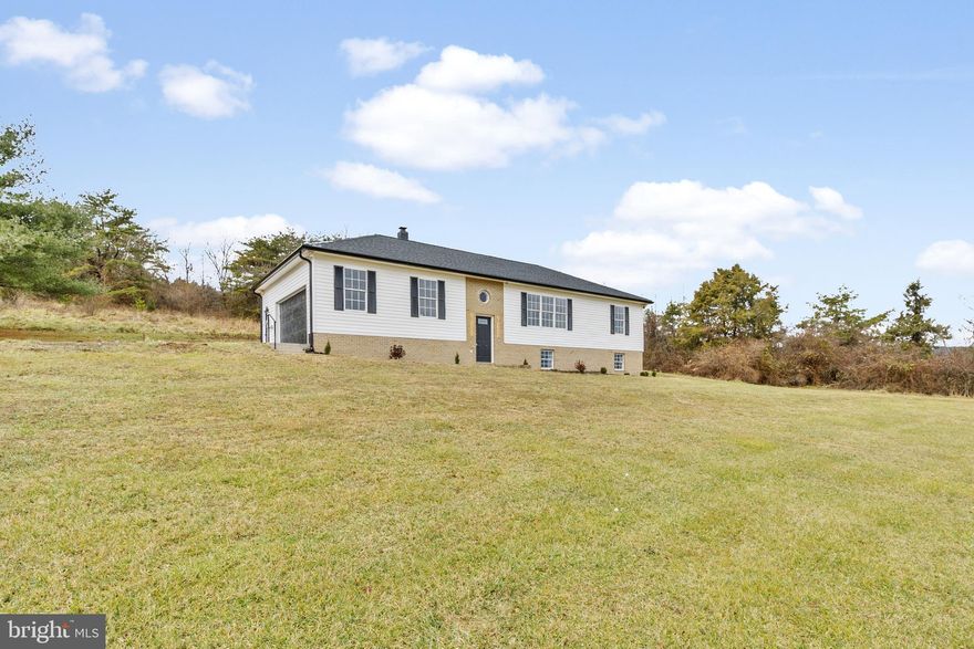 Beautiful all new design!! Home  comes with a new roof and gutters, new kitchen with soft close cabinetry granite counter tops and stainless steel appliances, new bathrooms, new floors, paint, new fixtures.....too much to list. A must see house on a huge unrestricted 3+ acre lot. Home features 3 bedrooms and 2 bathrooms on the upper/main level and an additional 4th bedroom on the lower level.  Professional photos coming soon.