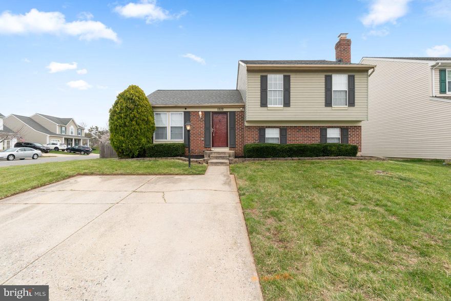 Well maintained home with four levels of finished living area on a large, fenced corner lot with a 2-car parking pad. Main level is bright with lots of light and offers a kitchen with SS appliances, living room and dining with gleaming hardwoods and vaulted ceilings with a slider that leads to a nice deck with large, fenced yard. Upper level has primary bedroom with closet and full bath, two nice size bedrooms and a full bath.  Lower level has a family room with a decorative fireplace and full bath, The lowest finished level can be used as a game room, media room, playroom or whatever the heart desires. Newer roof, water heater, washer/dryer and HVAC.