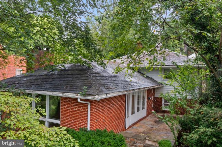 Amazing opportunity to bring your vision and personal touches to a home with tremendous potential and instant equity in a great neighborhood!  This 3-bedroom, 1.5-bath home is nestled in the serene and sought-after Original Northwood neighborhood. Enjoy peaceful mornings and relaxing evenings on the beautiful stone and slate front patio, surrounded by mature landscaping and neighborhood charm.  Enter to a spacious foyer, living room, dining room, & kitchen leading to a side patio. Hardwood flooring throughout the main and upper levels.  Upper level has three bedrooms and one full bathroom. The lower level has a spacious family room, half bath, and laundry/utility room with a side door walk out.  Unique to this home, you'll love the expansive off-street parking—featuring a rare two-car carport plus an additional space for a third vehicle. The stunning slate roof adds character and lasting durability. Whether you're a first-time buyer or looking to invest in a great location, this is an opportunity you won't want to miss. Prime Location: Close to shopping, dining, parks, the library, major commuter routes, and the light rail—offering the perfect blend of convenience and community living.  New Hot Water Heater.