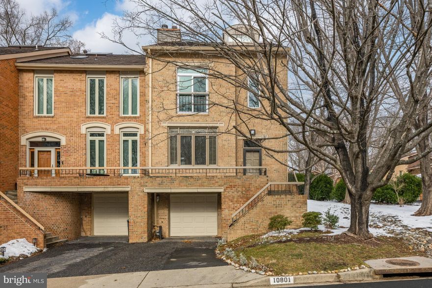 Welcome to 10801 Whiterim Drive, a fantastic end-unit townhome nestled in the highly sought-after neighborhood of Woodrock in Potomac, Maryland. This wonderful residence showcases a comfortable and functional floorplan, complete with new windows, an outdoor deck, and a lofted living space. Enter the front door and ascend into the open family room that is bathed in natural light from the oversized windows wrapped in plantation shutters. The wood-burning fireplace is enveloped in a mirrored wall, and hardwood flooring can be found throughout this main level. Step up into the dining area, ideal for entertaining with access to the deck through sliding glass doors. The kitchen features wood cabinetry and a charming breakfast area, highlighted by elevated ceilings and skylights. A convenient powder room and a hall closet round out this main level. Upstairs, you will find two bedrooms, two full bathrooms, and a versatile lofted living area. The generously sized primary bedroom features soaring ceilings, expansive windows with blackout shades, and a spacious walk-in closet. The en-suite bathroom highlights dual vanities, a walk-in shower, a bathtub, and is awaiting your updates and design. The bonus loft in the primary suite is ideal for an at-home office, or additional living space. A spacious double-door storage room is not to be missed. The secondary bedroom showcases an oversized window with blackout shades, in addition to the sliding glass door that opens to a Juliet balcony. The en-suite bathroom features a shower/tub combination, and offers ample space for an auxiliary bathroom. Descend to the lower level where a  brick-surround wood-burning fireplace with a wood mantel creates a cozy atmosphere. A third full bathroom with a walk-in shower can be found on this lower level, in addition to the washer and dryer. An attached one-car garage is fully equipped with an EV charger. Some additional updates and improvements that have been made include new Hardie Plank siding, and a Nest system for smart climate control. This home is perfectly situated in Potomac, just minutes away from the Potomac Village, Clara Barton Parkway, I-495 and Great Falls National Park. With all this fabulous home has to offer in such a desirable community, it will surely not last. Do not miss the opportunity to make this your home.