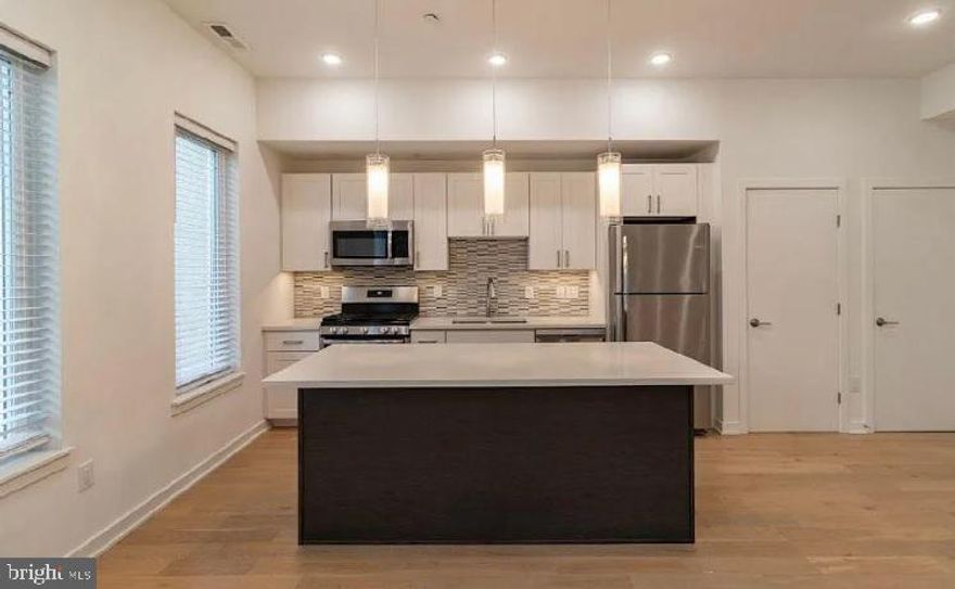 Experience luxury living at its finest in this stunning new construction top floor home! With two spacious bedrooms, one and a half bathrooms, and three-level living, this home offers ample space and an abundance of natural light.

Step outside onto your own private rooftop terrace, the perfect place to relax and take in stunning views of the city. Inside, enjoy modern finishes, wood flooring throughout, and high expansive ceilings that create an airy, open feel.

Cook up a storm in the fully-equipped kitchen, complete with gas cooking, and enjoy the convenience of a full-size washer and dryer for added convenience. With ample street parking available and a controlled access area for parcels, you can rest easy knowing your belongings are safe and secure.

Managed by the trusted team at 3Horizons, you'll have access to a convenient resident portal for easy rental payments, service requests, and 24/7 emergency maintenance. Don't miss out on the chance to make this gorgeous home yours today!