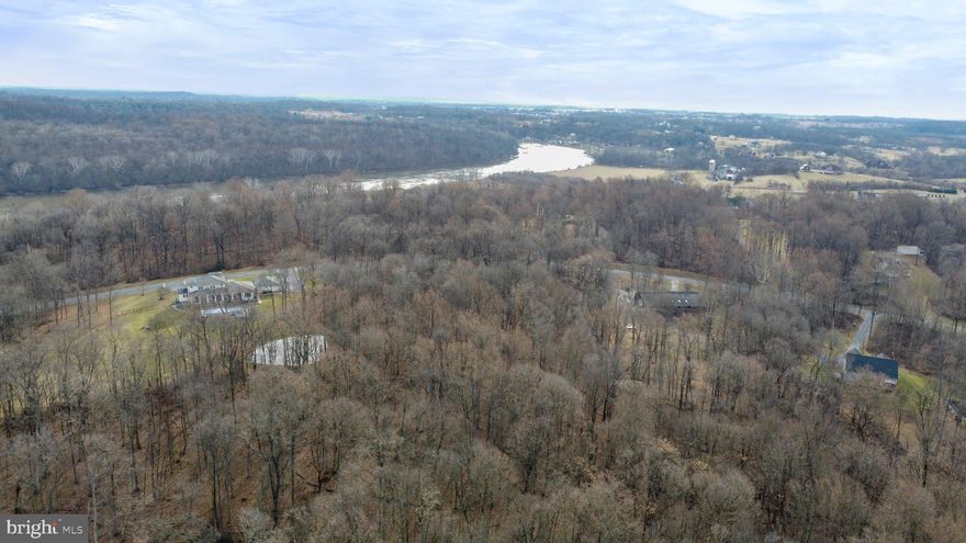 Welcome to an unparalleled opportunity to bring your vision to life in the coveted Potomac River community of Crossings on the Potomac! This 3+ acre wooded (and perked) lot offers the perfect canvas for building the residence you've always dreamed about. For those with a passion for boating and a love for the river, this property stands out as an ideal choice. With an exclusive gated entrance to the community marina with boat ramp and seasonal docks, you'll enjoy easy access to some of the best deep water boating and fishing the area has to offer!